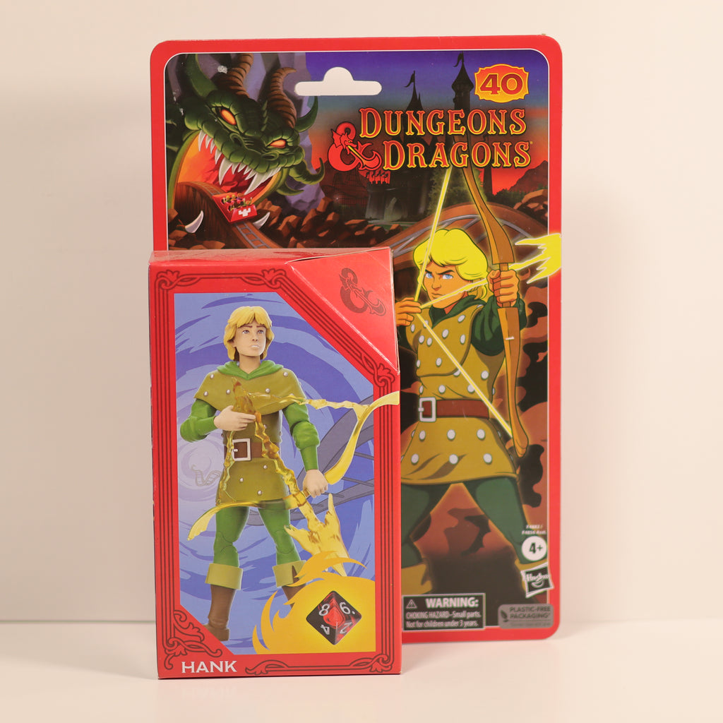 Packaged Dungeons & Dragons figurine with character illustration on a beige background