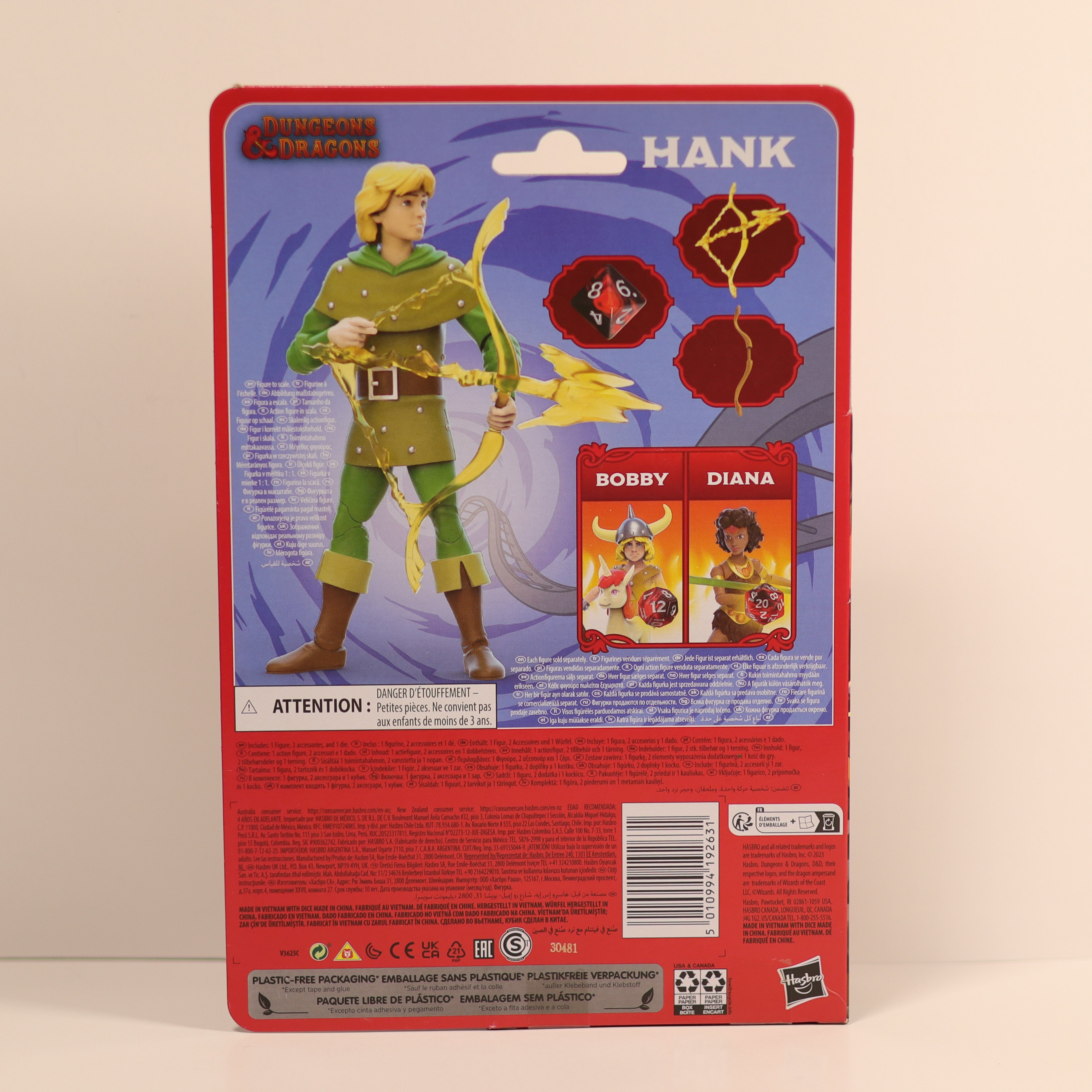 Action figure packaging with character illustration and product details on a beige background
