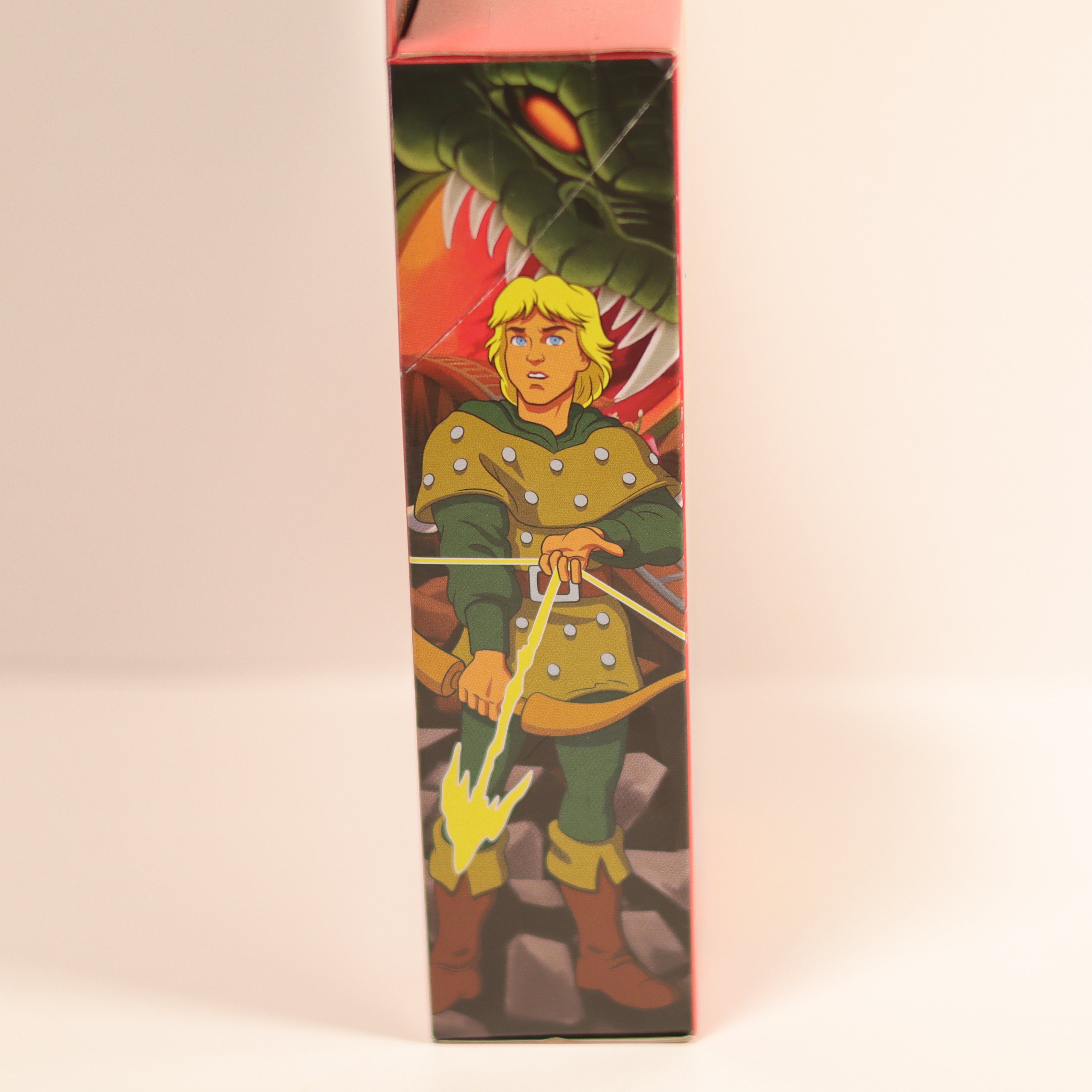 Cartoon character packaging with a dragon illustration on a beige background