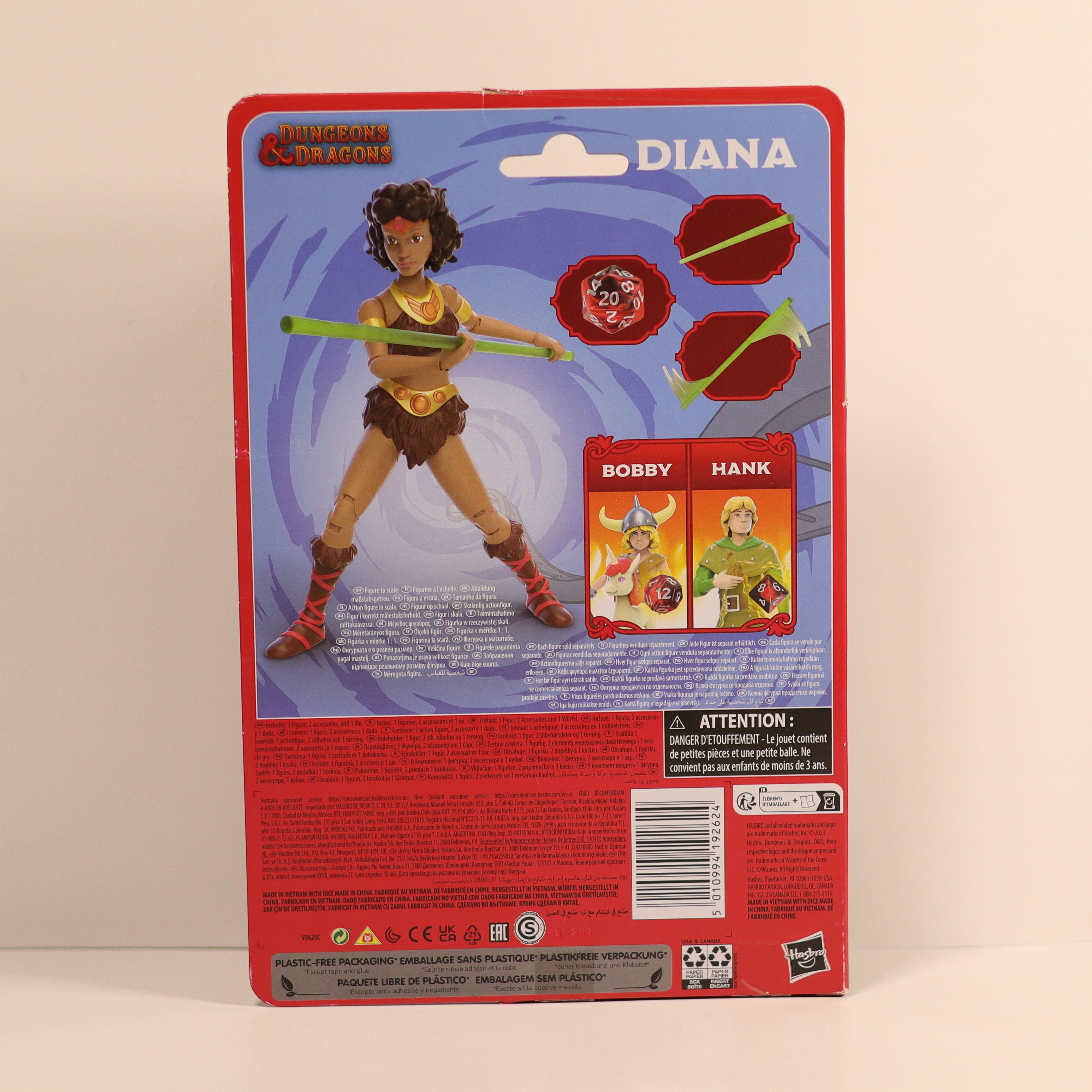 Action figure packaging with character illustration and product details on a beige background