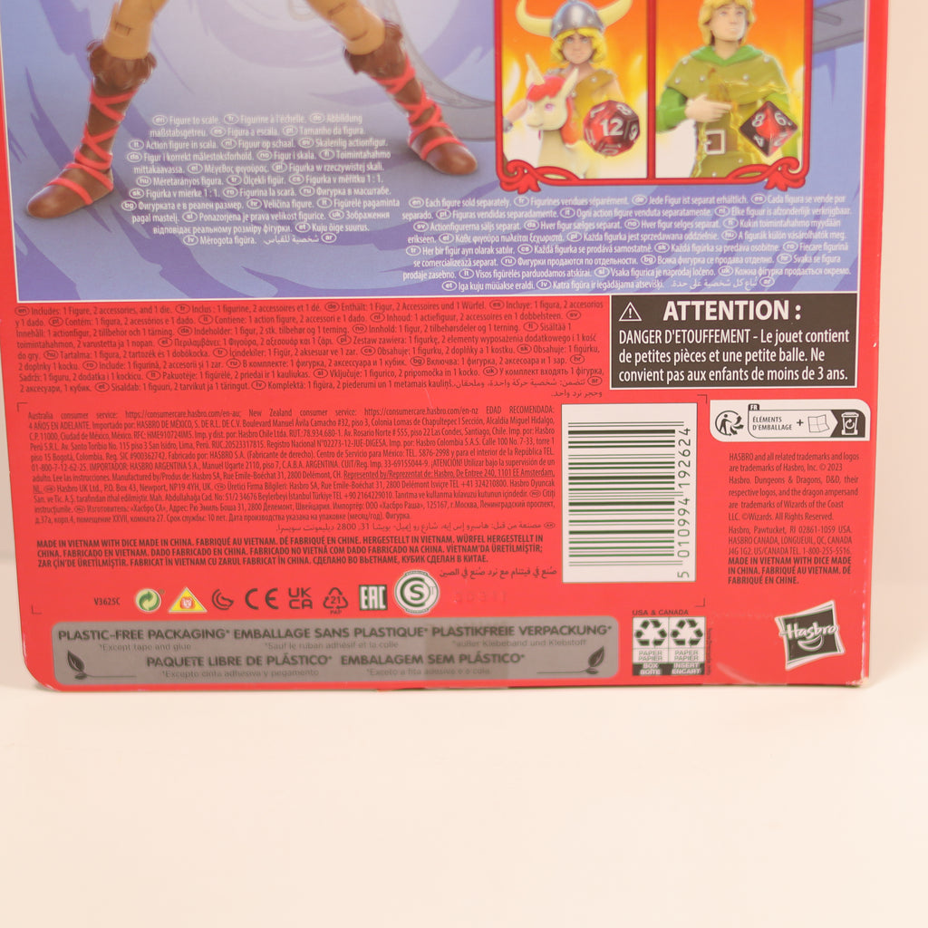 Back of a toy packaging with text and images of a character, featuring Hasbro branding.