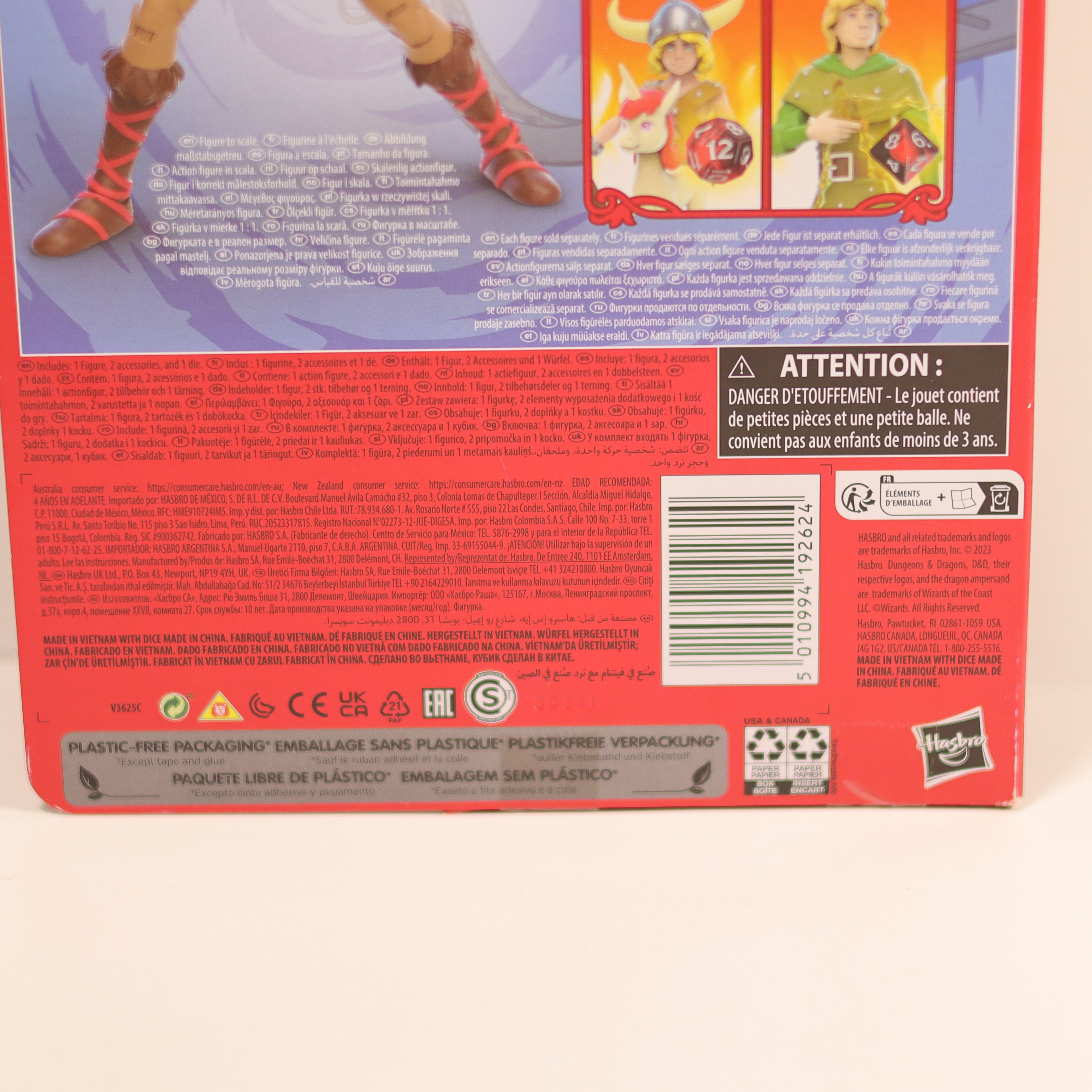 Back of a toy packaging with text and images of a character, featuring Hasbro branding.