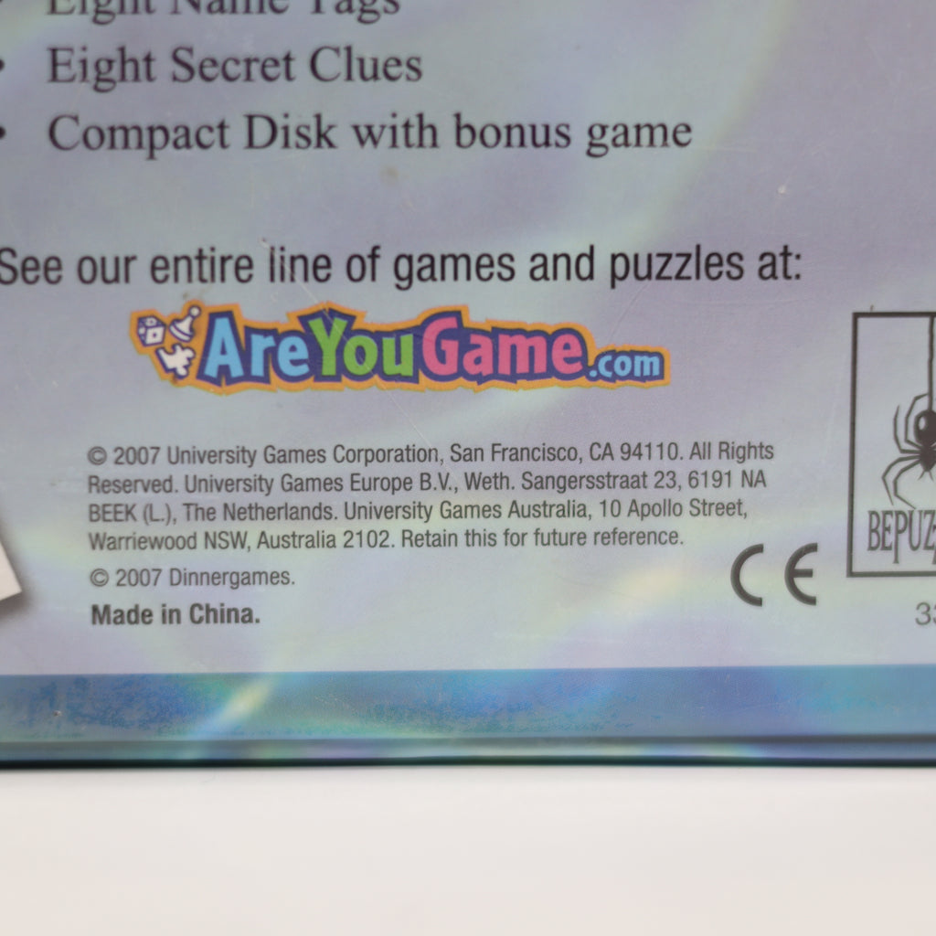 Back of a game packaging with branding and contact information.