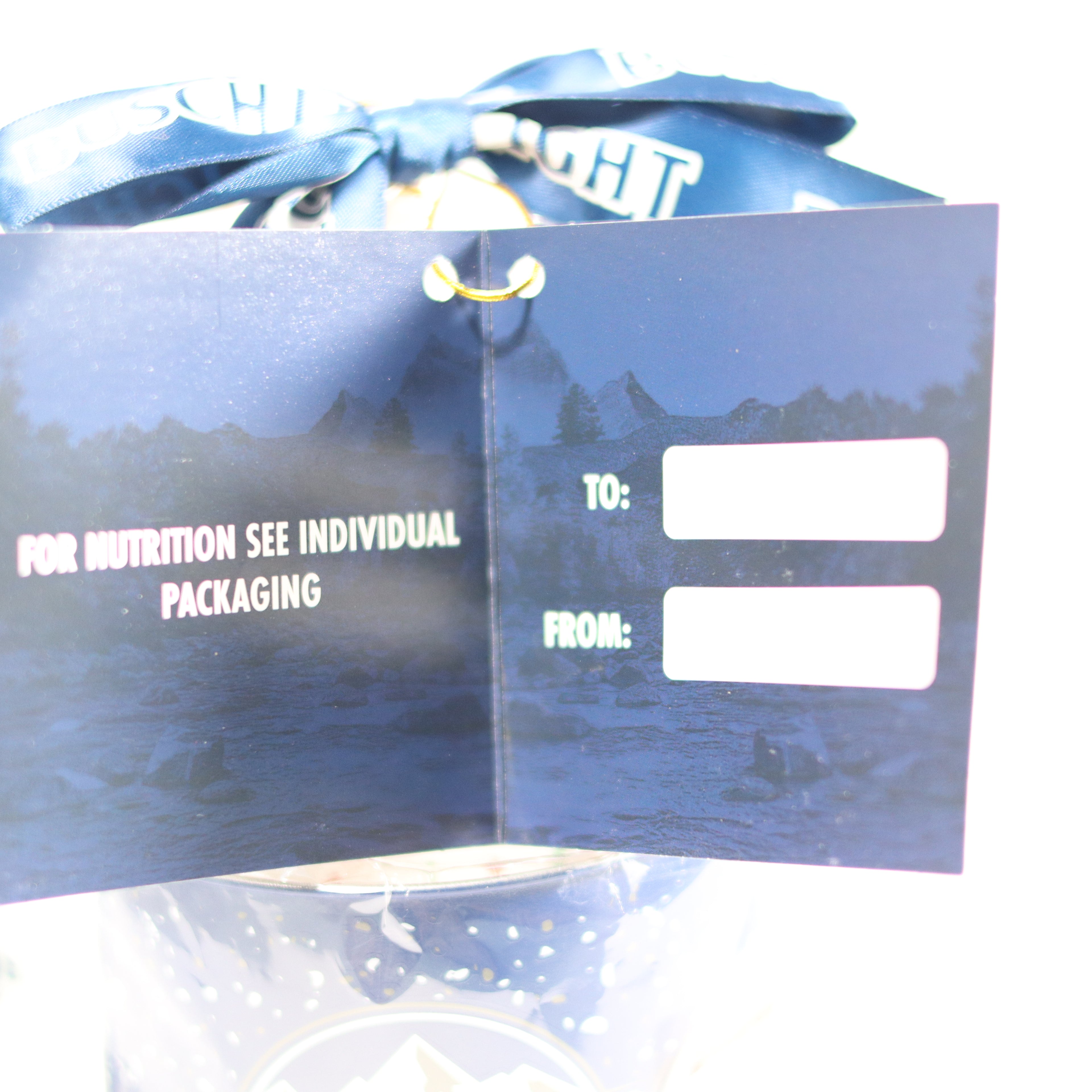 Blue gift bag with white text and a bow, partially open to reveal inside content.