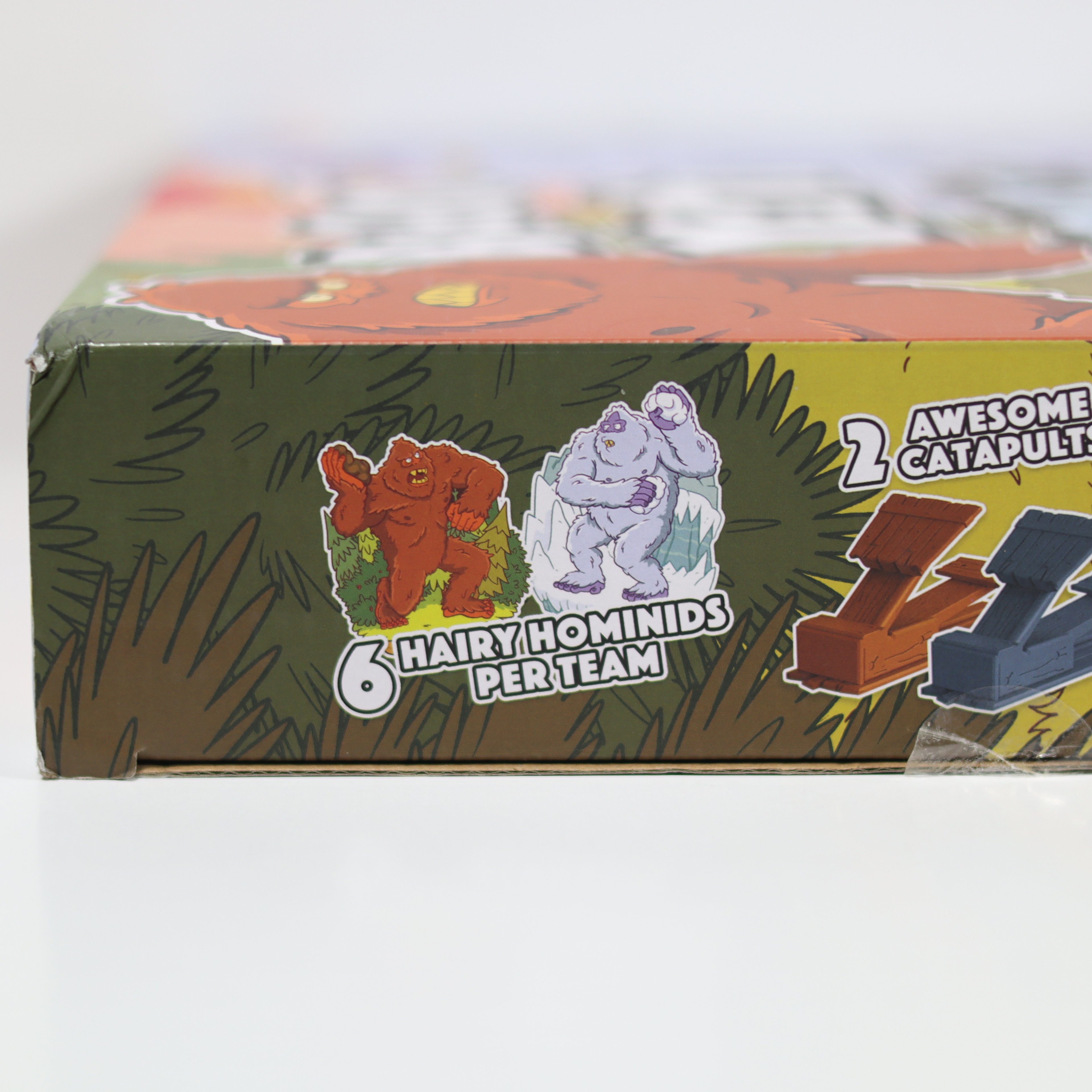 Toy box with illustrations of characters and text on a white background