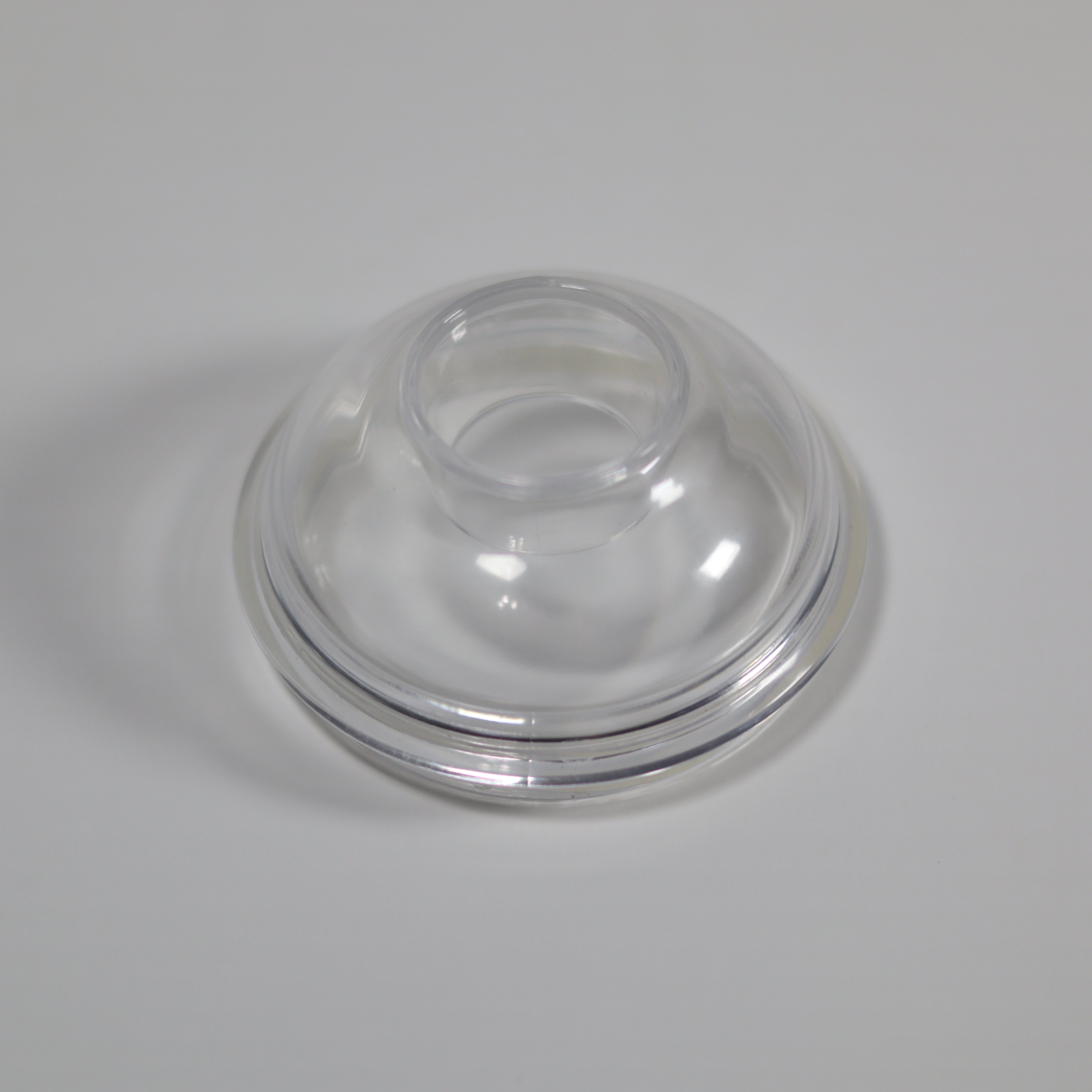 Clear plastic dome on a gray background