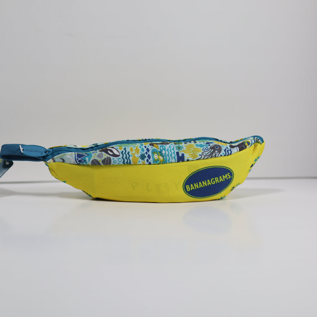 Yellow bag with blue zipper and 'Bananagrams' logo on a white background