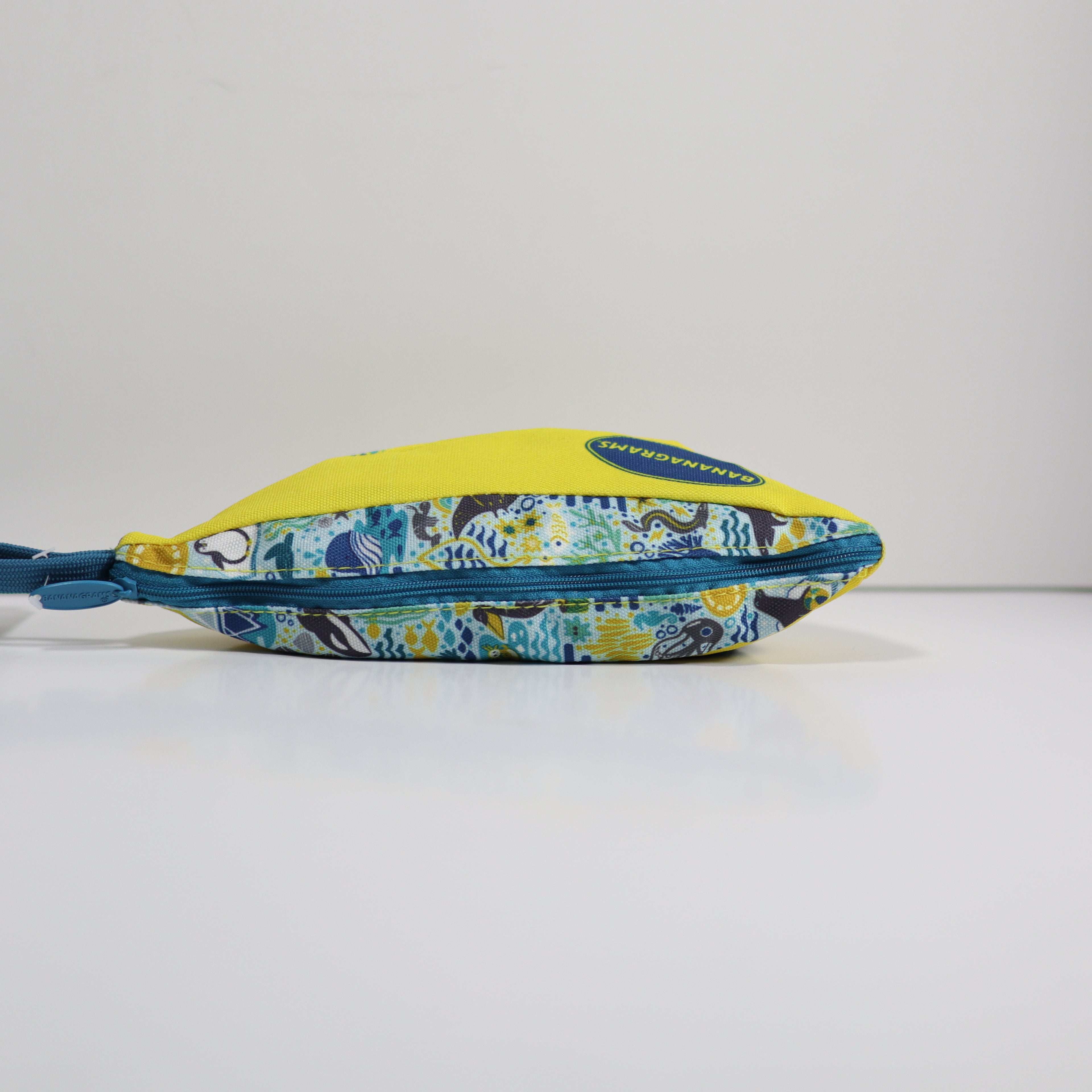 Zipper pouch with floral pattern and yellow top on a white background