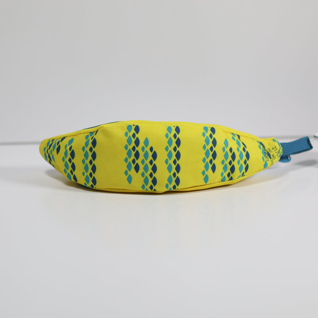 Yellow fabric bag with blue pattern and handle on a white background
