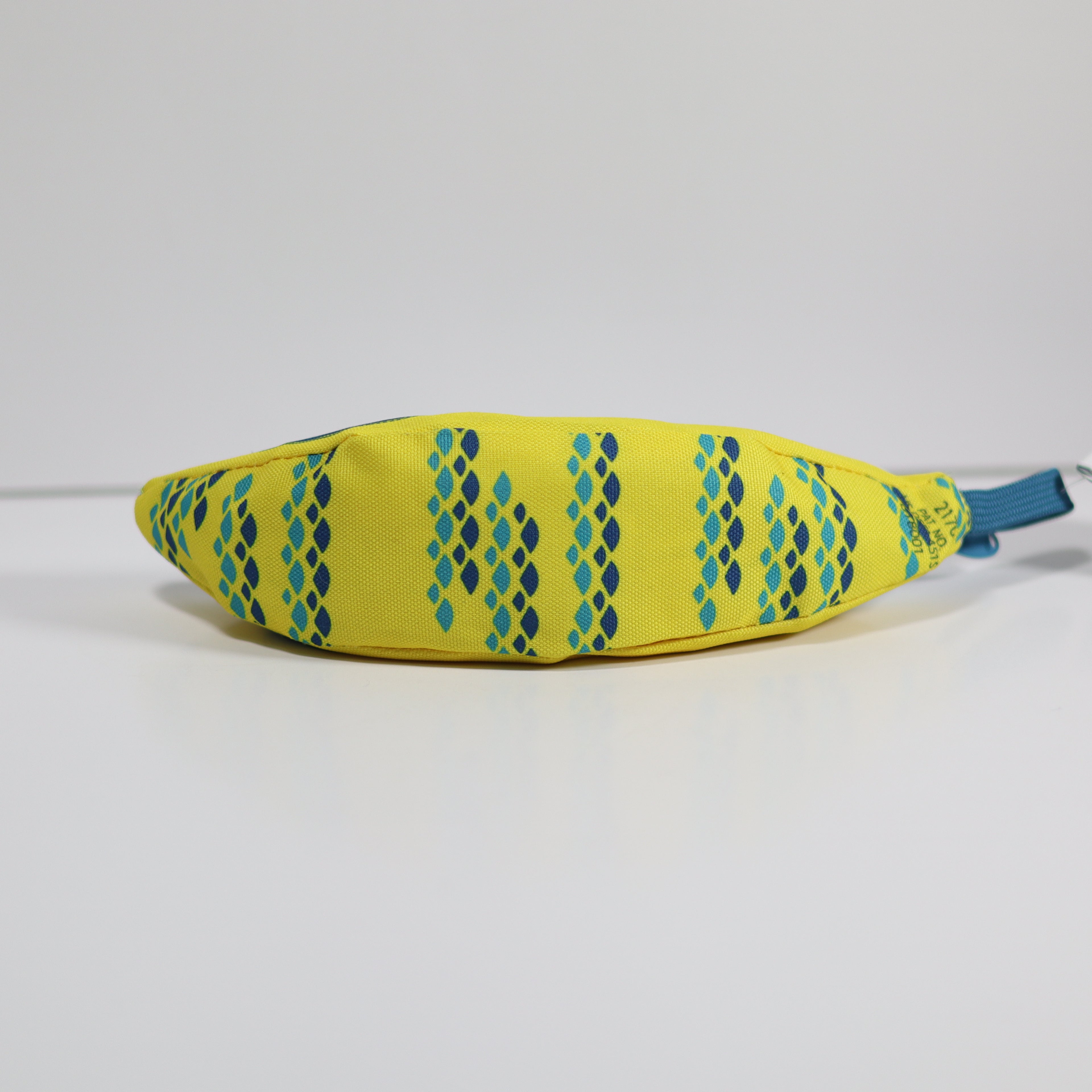 Yellow fabric bag with blue pattern and handle on a white background