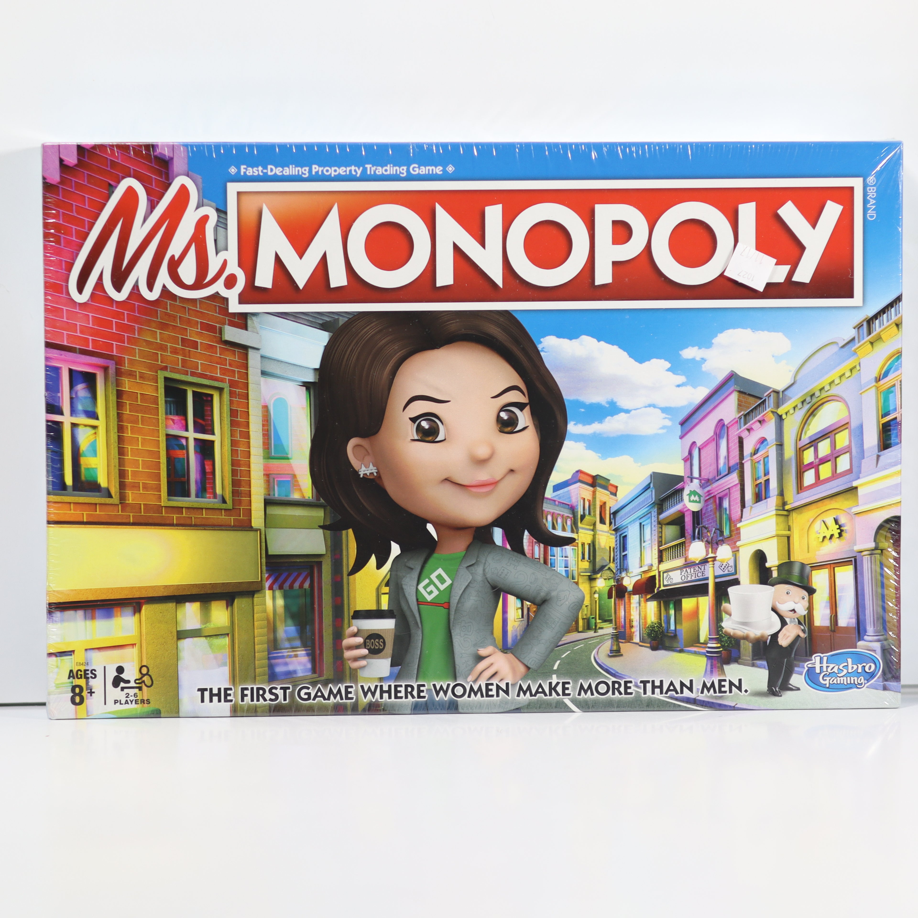 Box of 'Ms. Monopoly' board game with a character and colorful cityscape design.