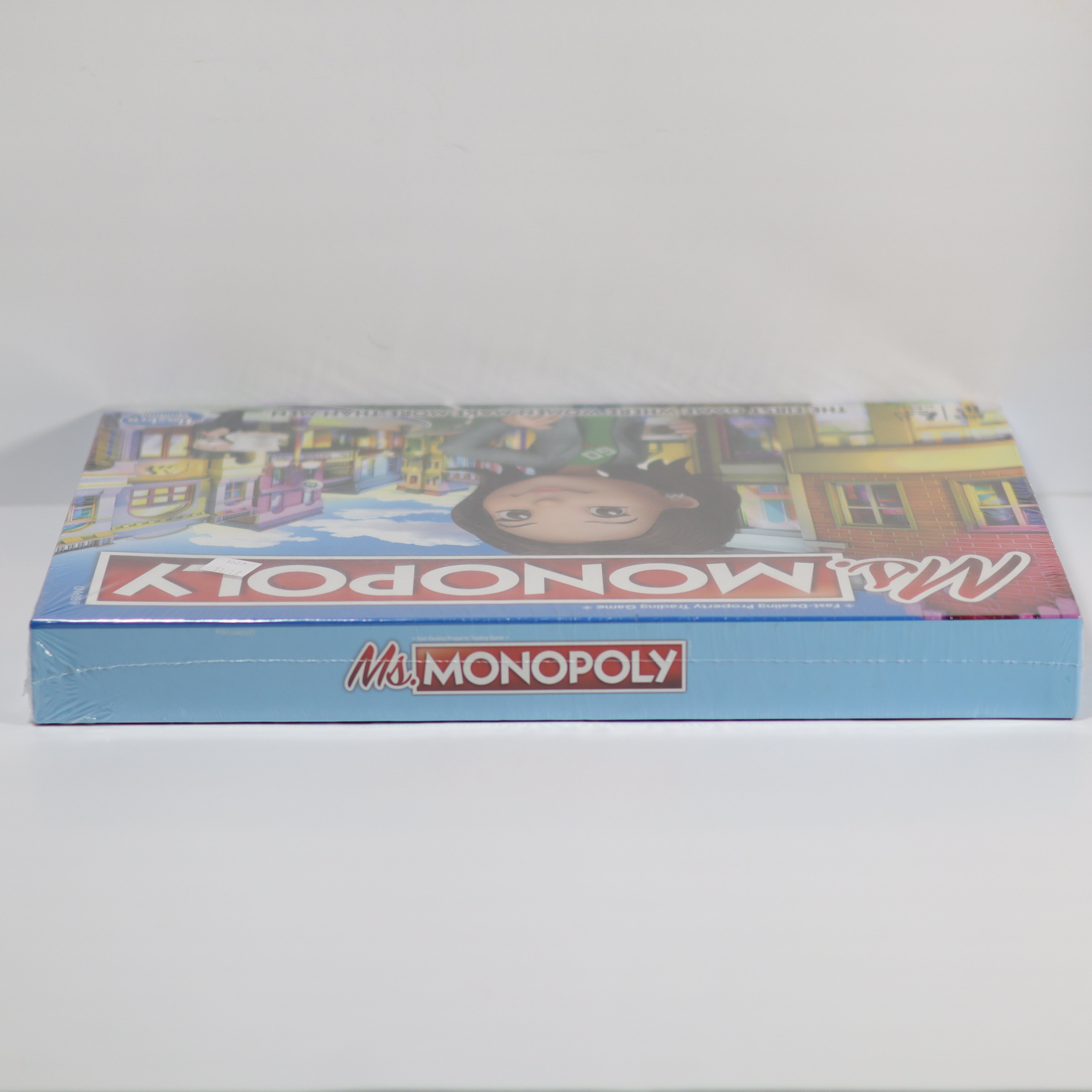 Monopoly game box on a light gray background
