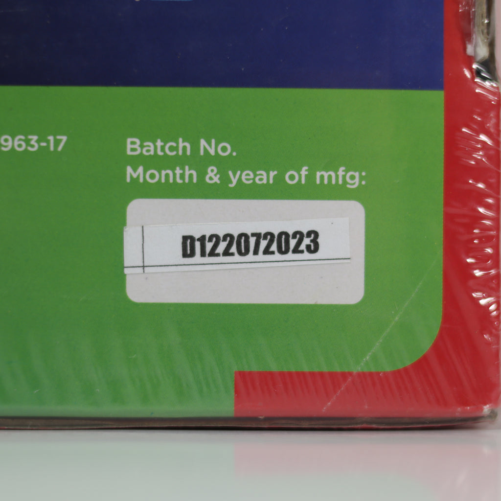 Product packaging with a batch number label on a green and red background