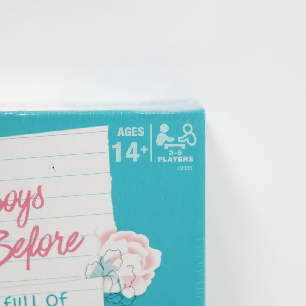 Product packaging with age and player information on a white background