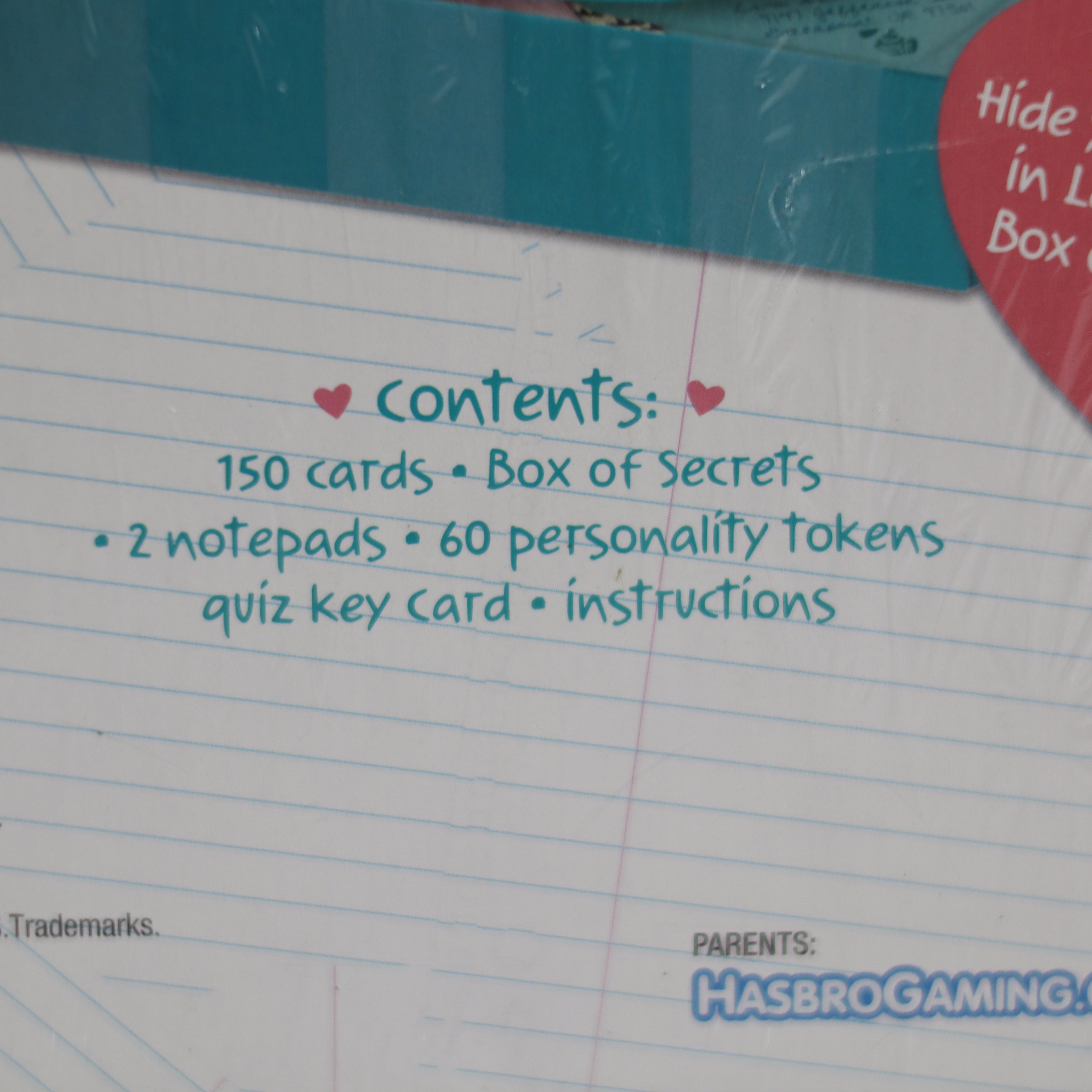Notebook with text listing contents and HasbroGaming branding