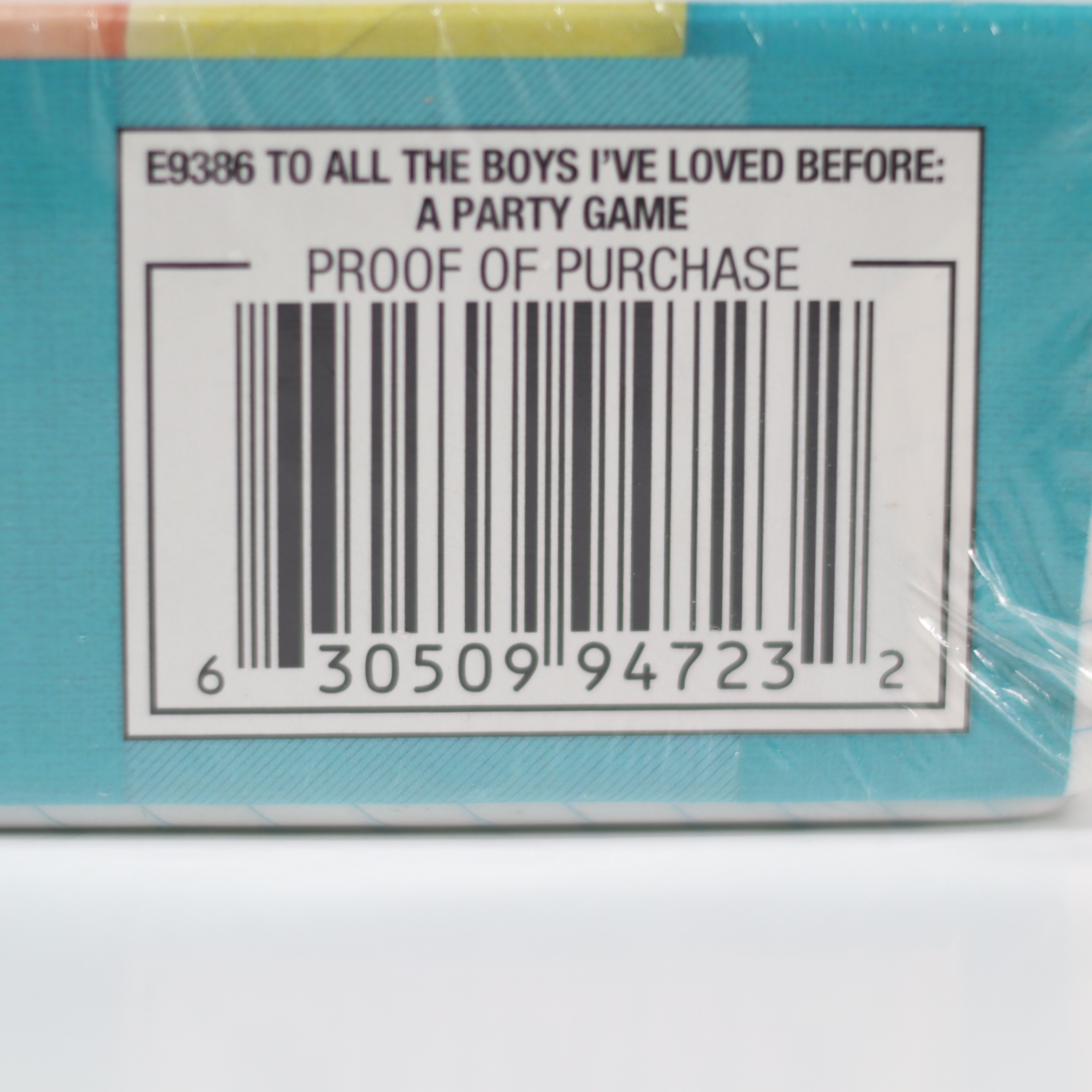 Bar code on a product packaging with text 'E9386 TO ALL THE BOYS I'VE LOVED BEFORE: A PARTY GAME PROOF OF PURCHASE'.