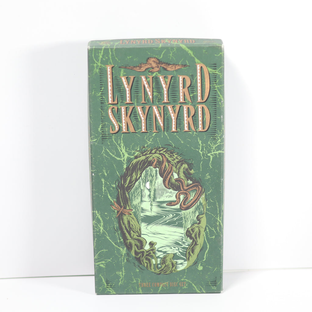 Green album cover with 'Lynyrd Skynyrd' text and wavy design on a white background