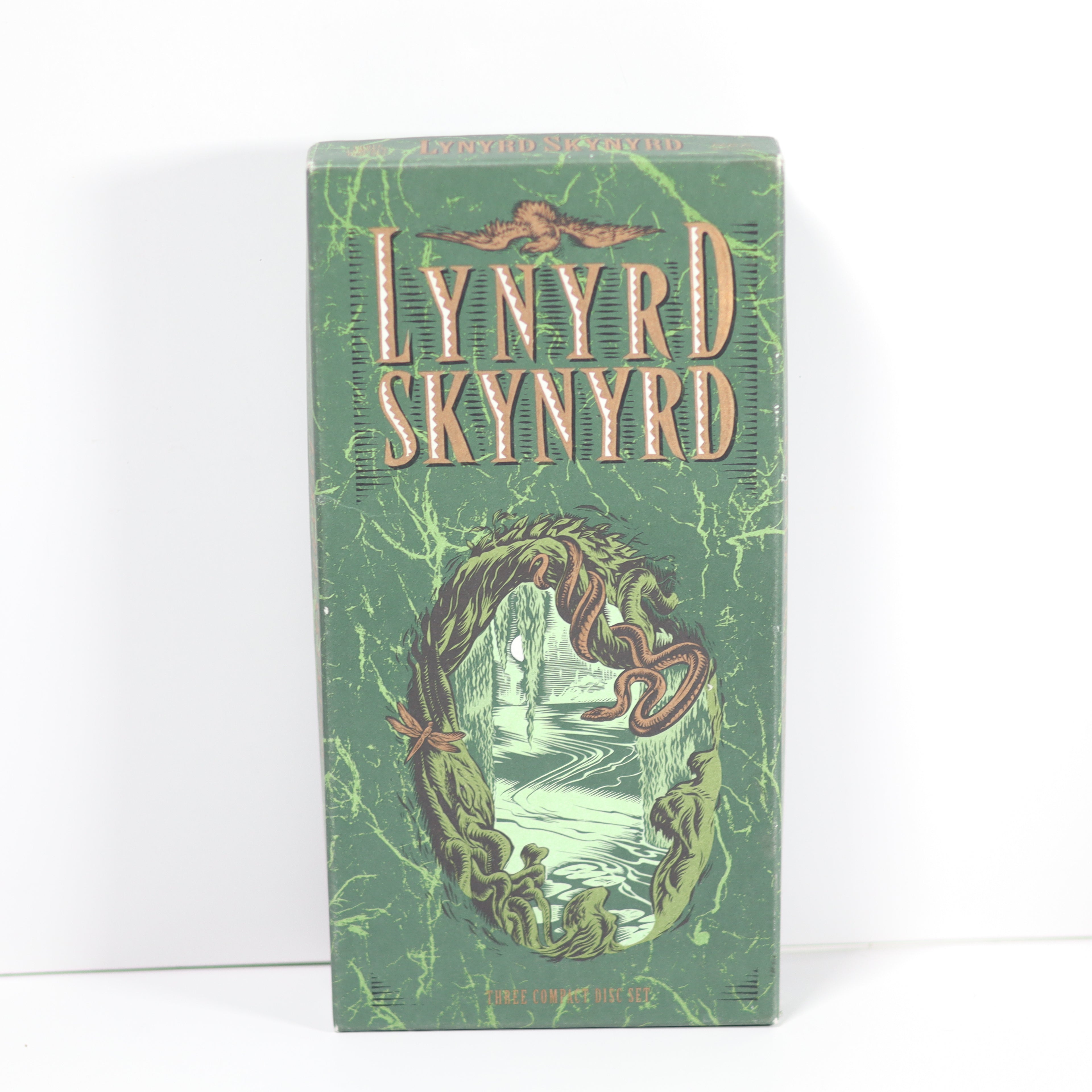 Green album cover with 'Lynyrd Skynyrd' text and wavy design on a white background