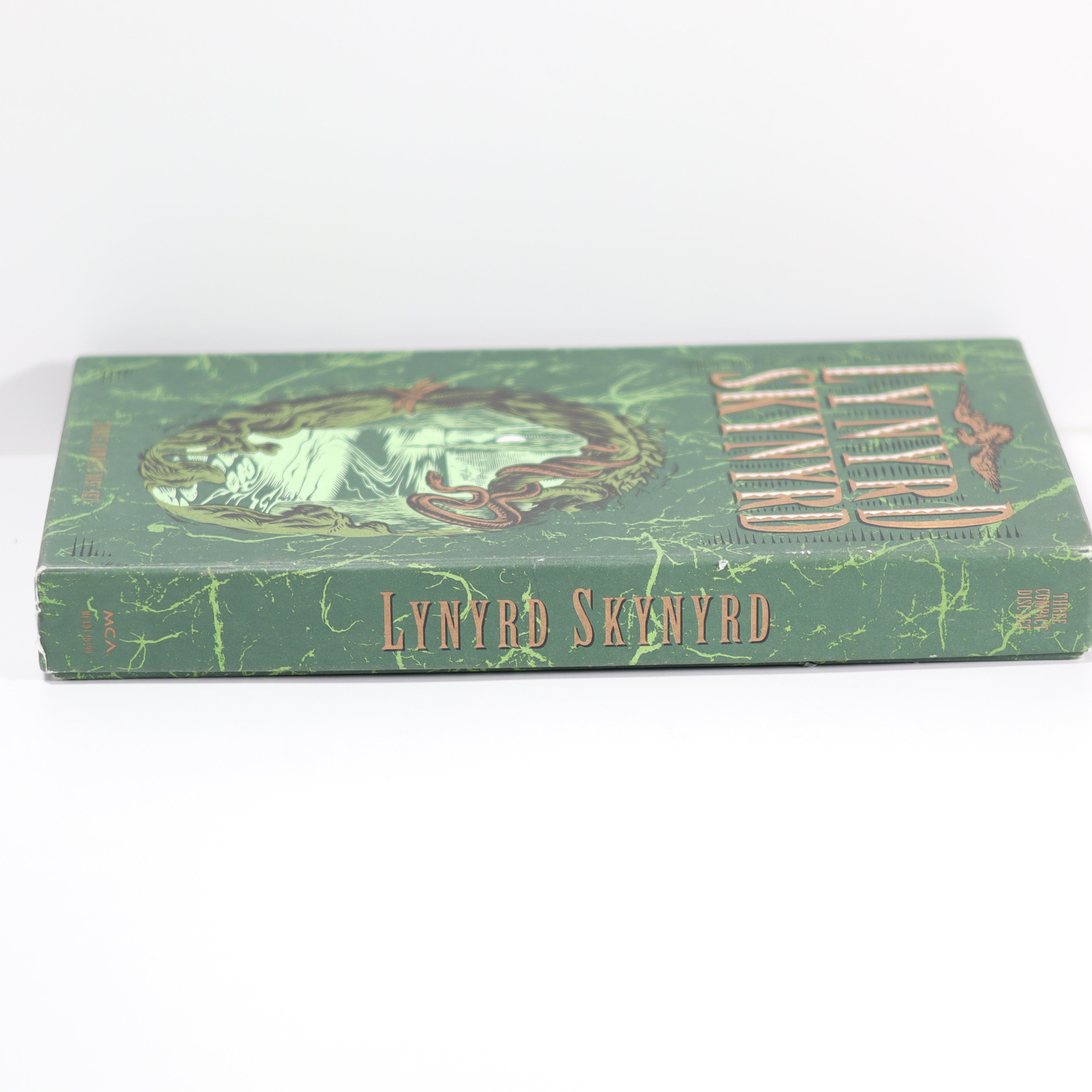 Green book with 'Lynyrd Skynyrd' on a white background