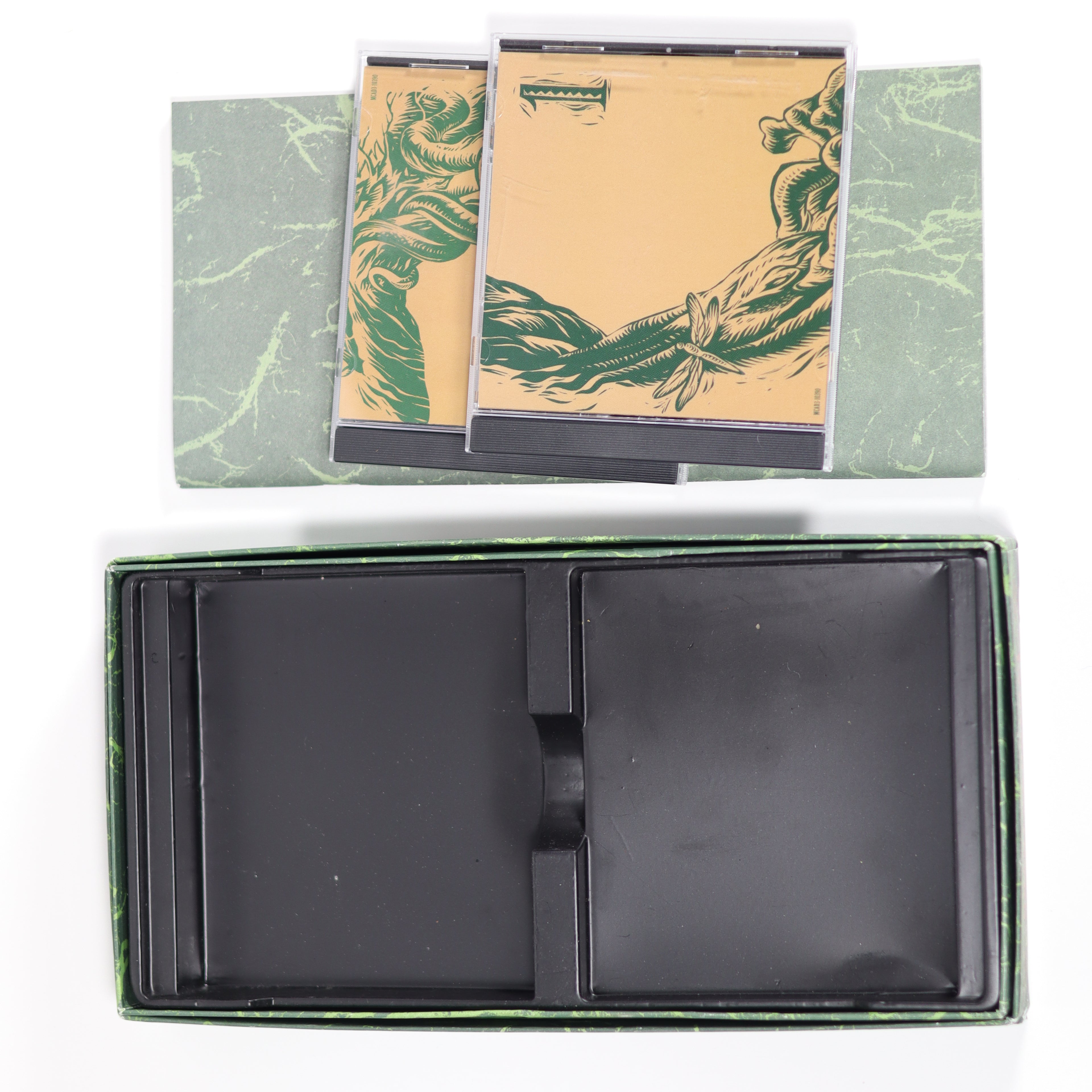 Black leather wallet with green marbled paper and a card featuring a green dragon design.