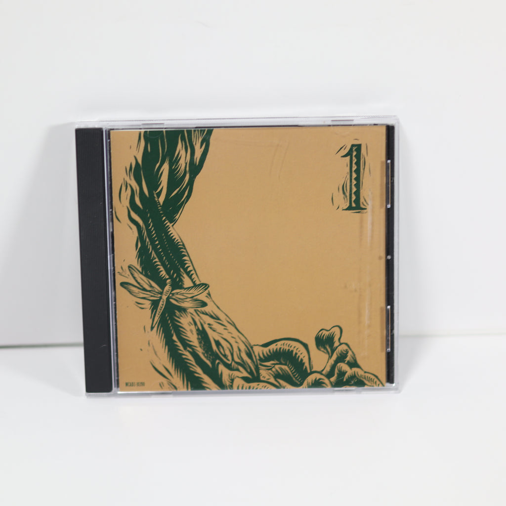 CD case with green illustrations on a beige background