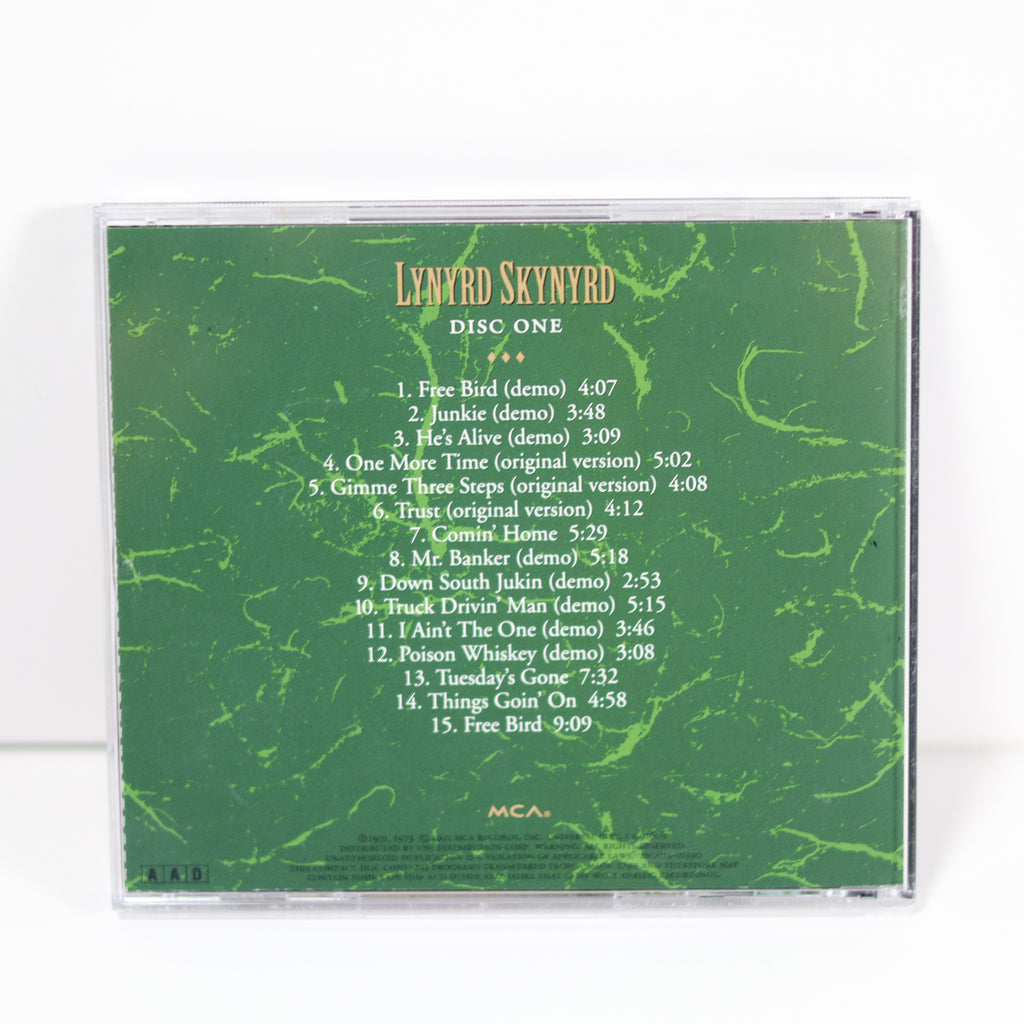 CD case with green marbled design and text listing songs on Disc One of a Lynyrd Skynyrd album.