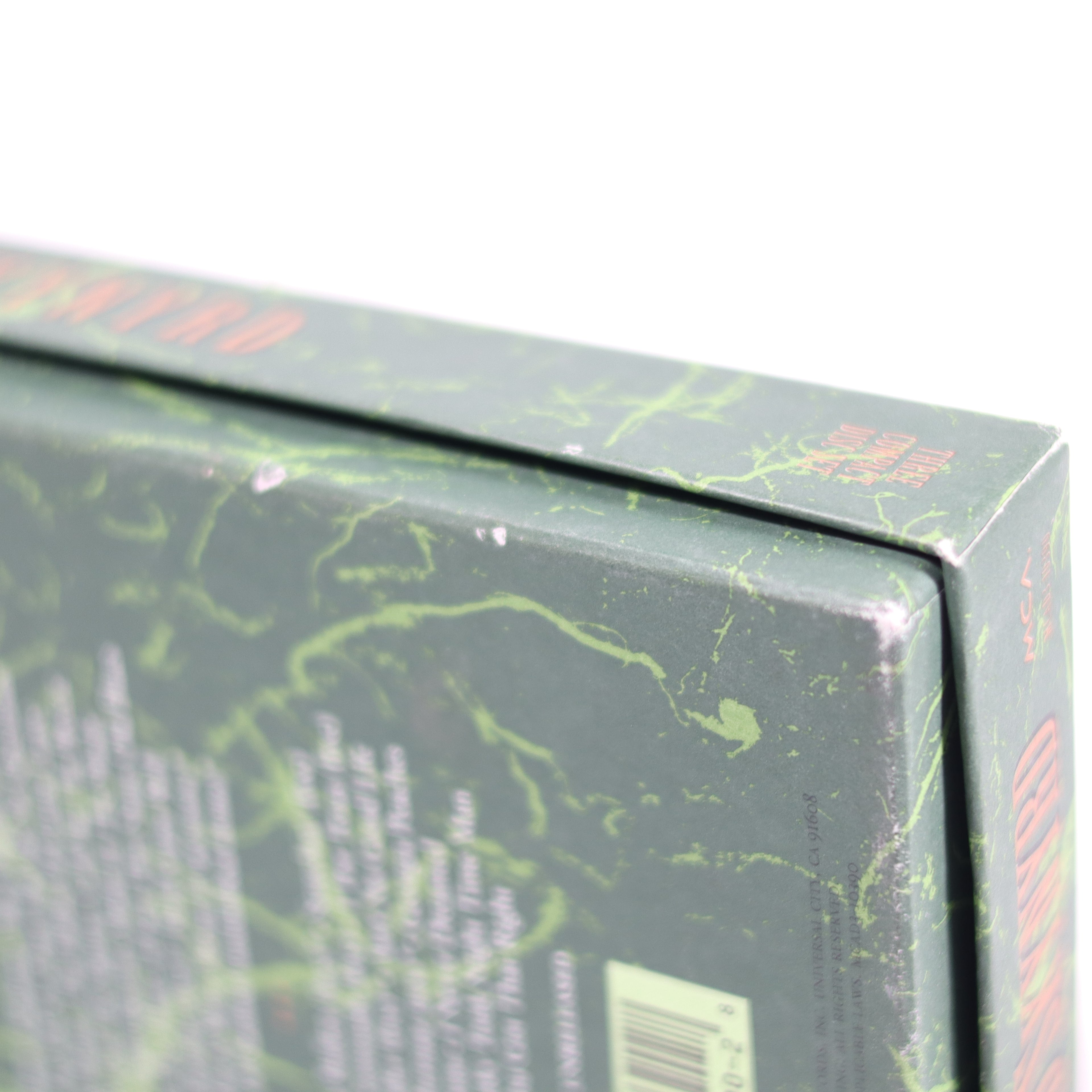 Close-up of a green marbled product packaging with text.