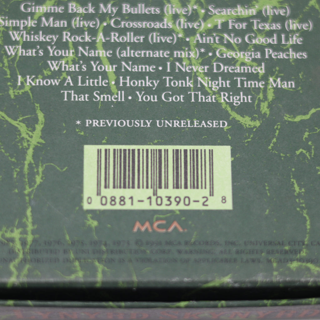 Back cover of a music album with tracklist and barcode on a green textured background