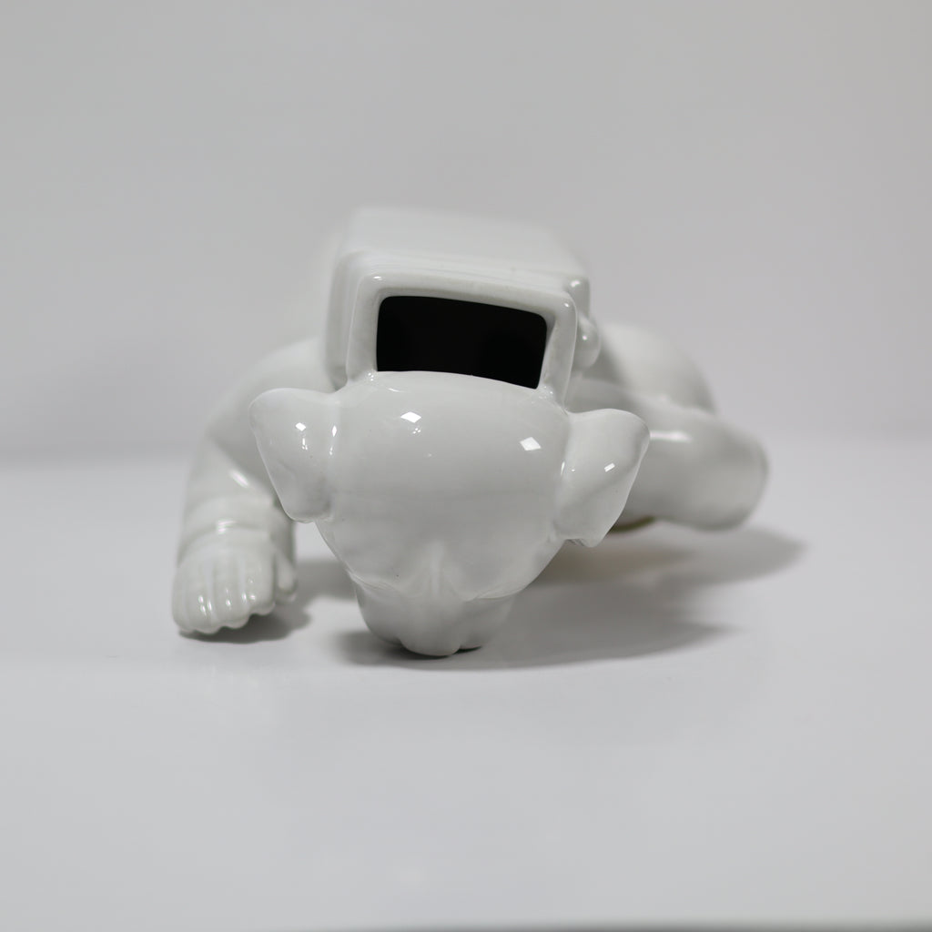 White robot-like figure on a light gray background