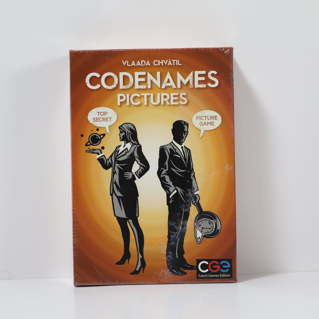 Board game box for 'Codenames Pictures' with silhouettes of a man and a woman on an orange background.