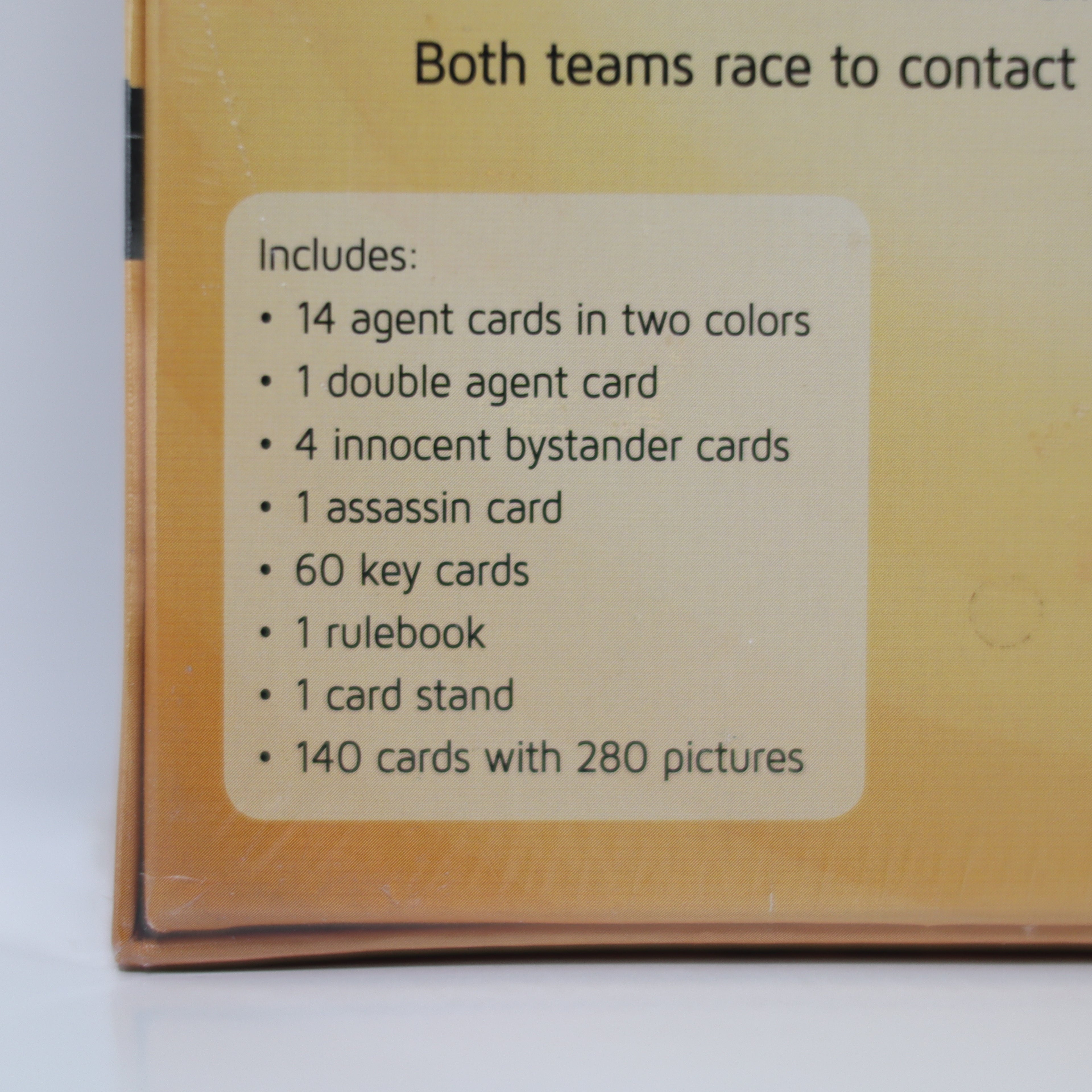 Card game box with list of included cards on a white background