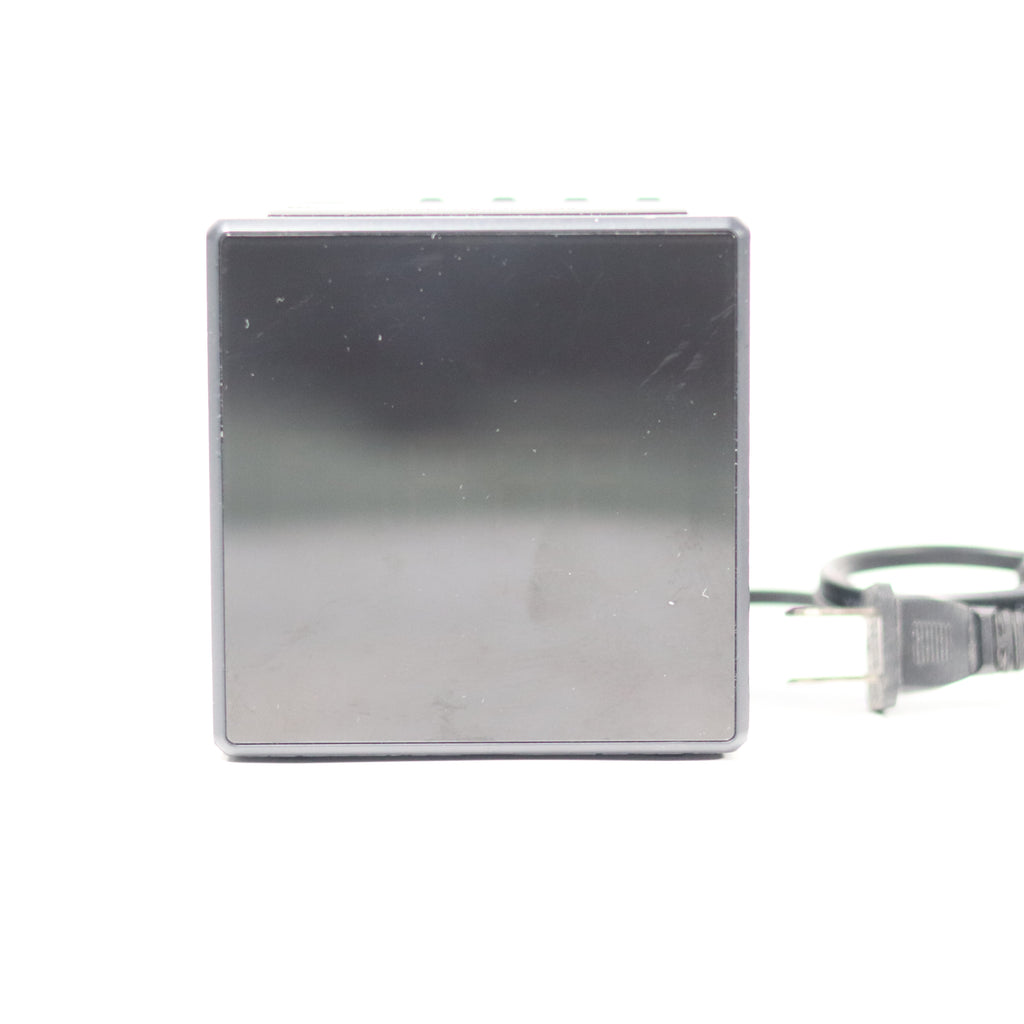 Rectangular metal device with a power cord on a white background