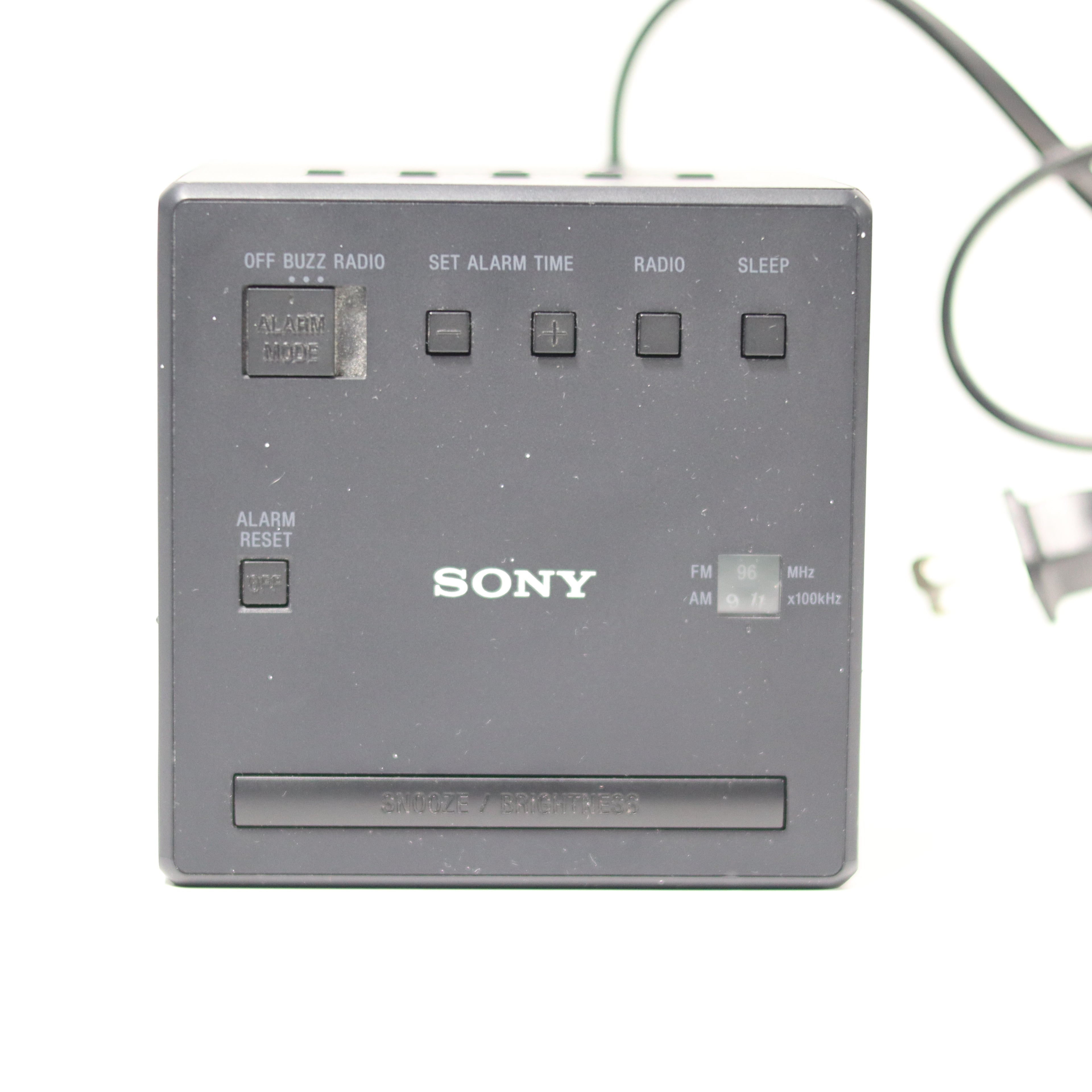 Vintage Sony alarm clock radio on a white background