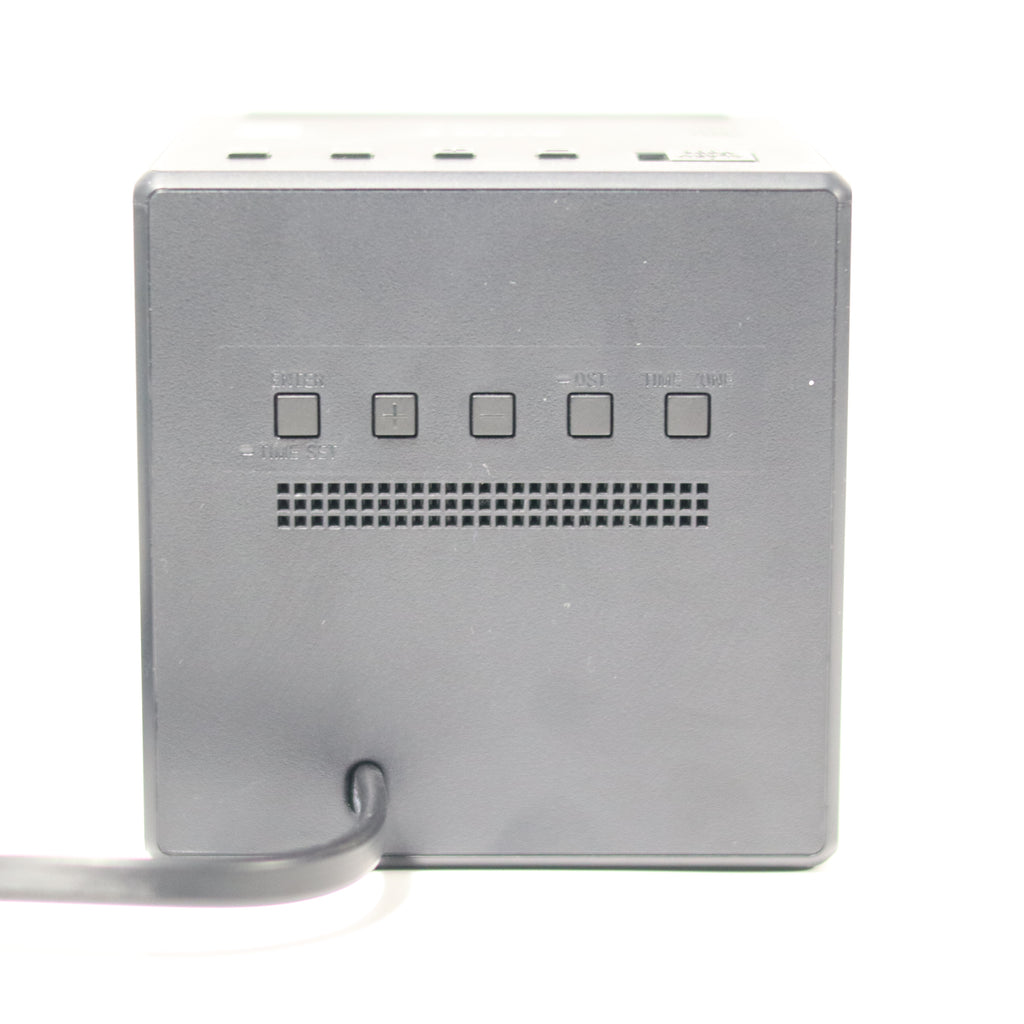 Silver electronic device with control buttons on a white background