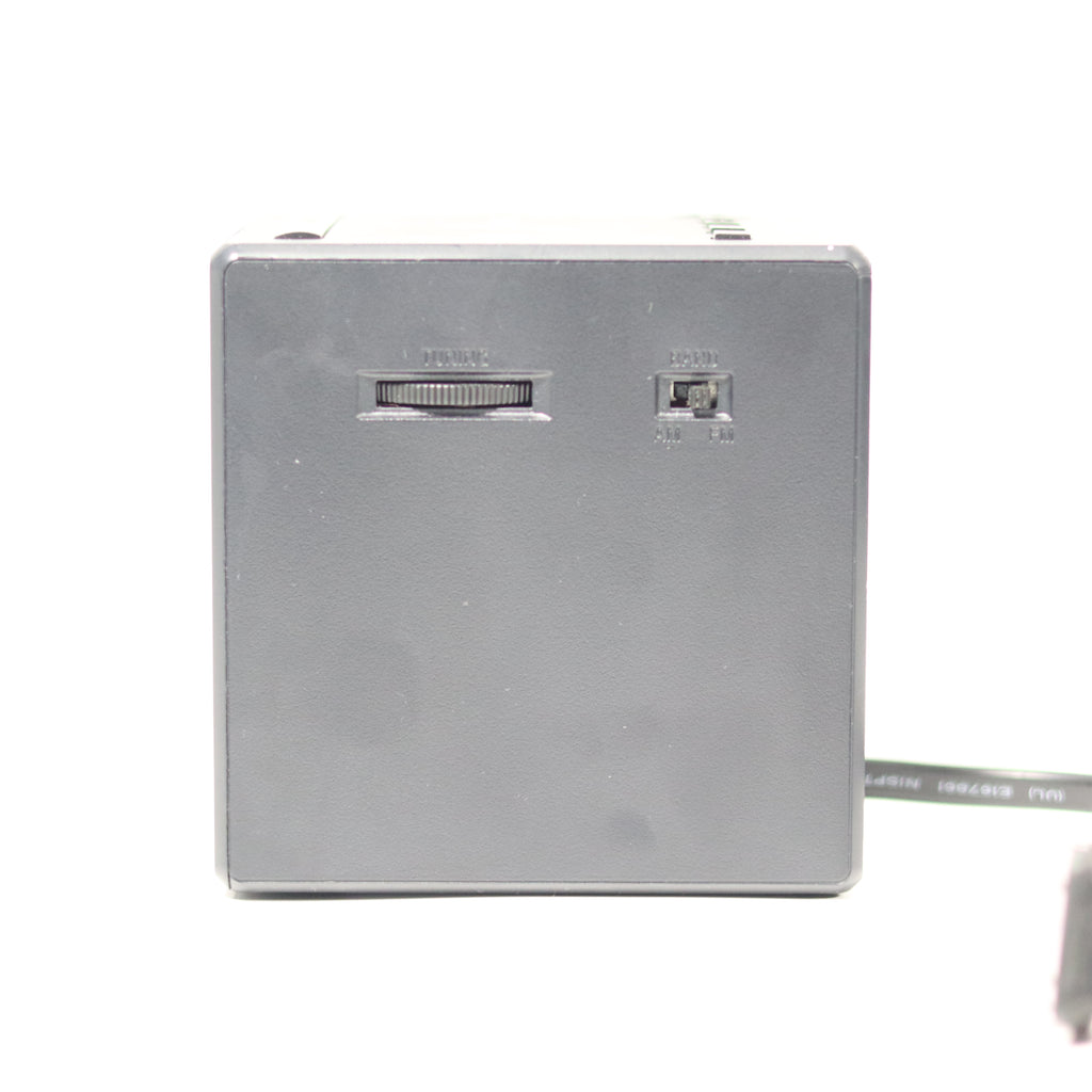 Metallic rectangular device with ports on a white background