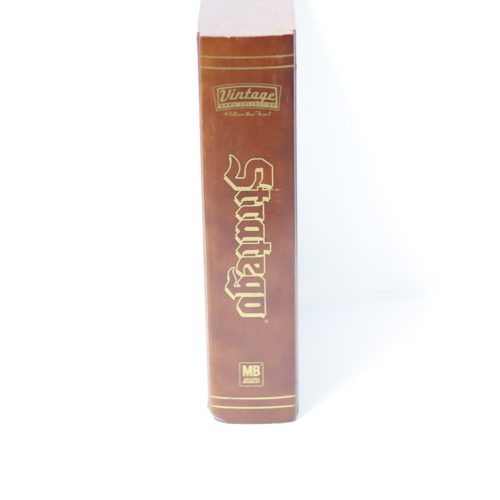 Brown book with gold text on a white background