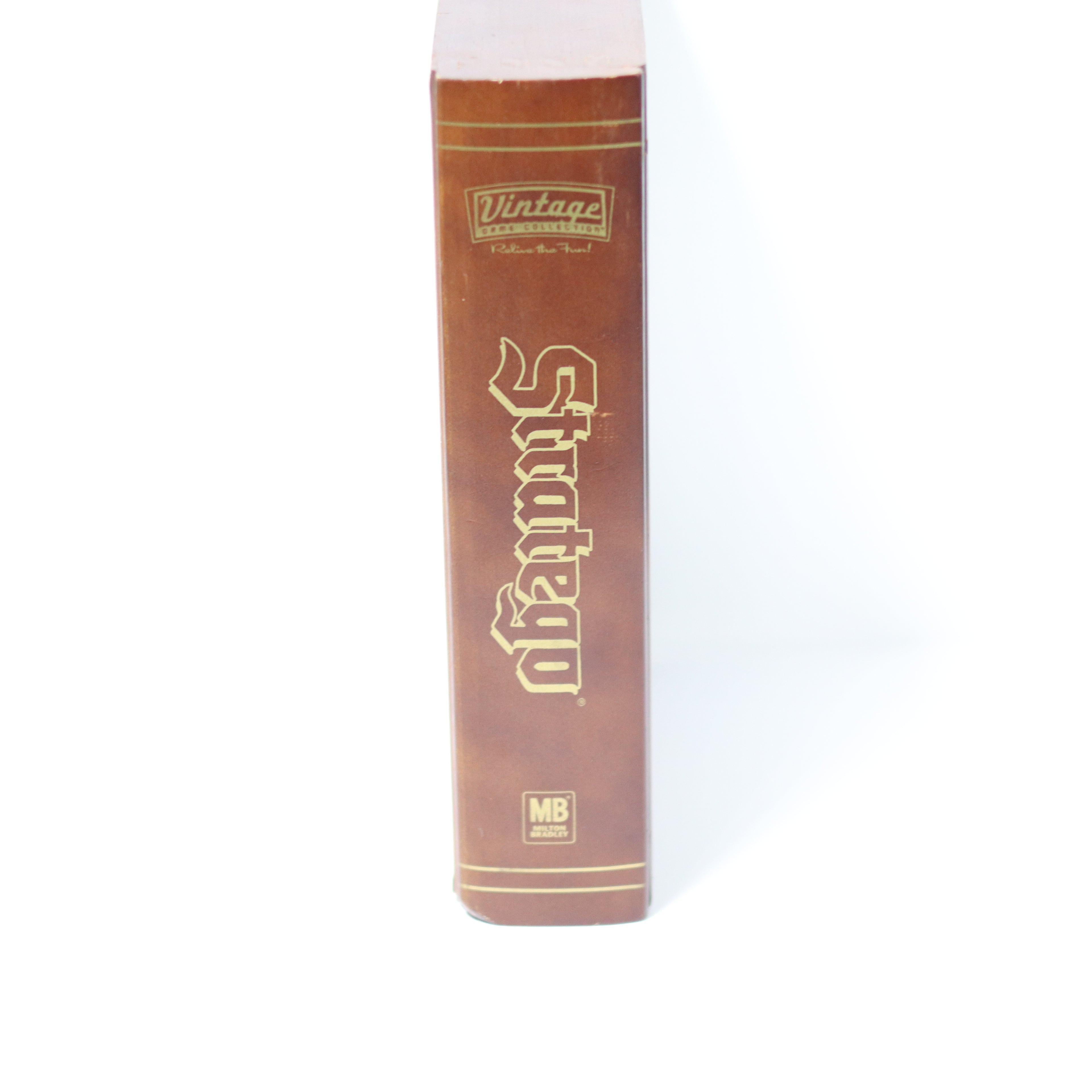 Brown book with gold text on a white background