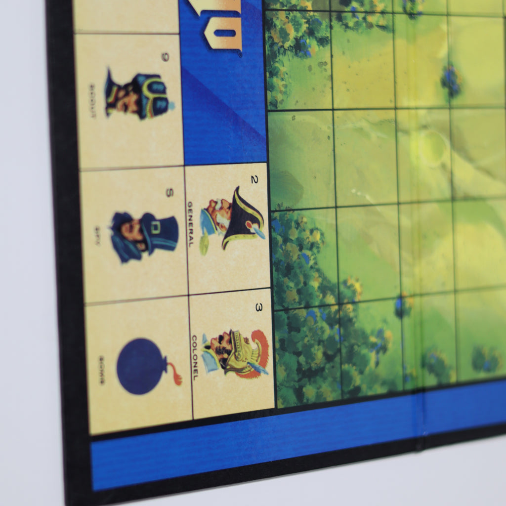 Board game piece with military figures and a map background