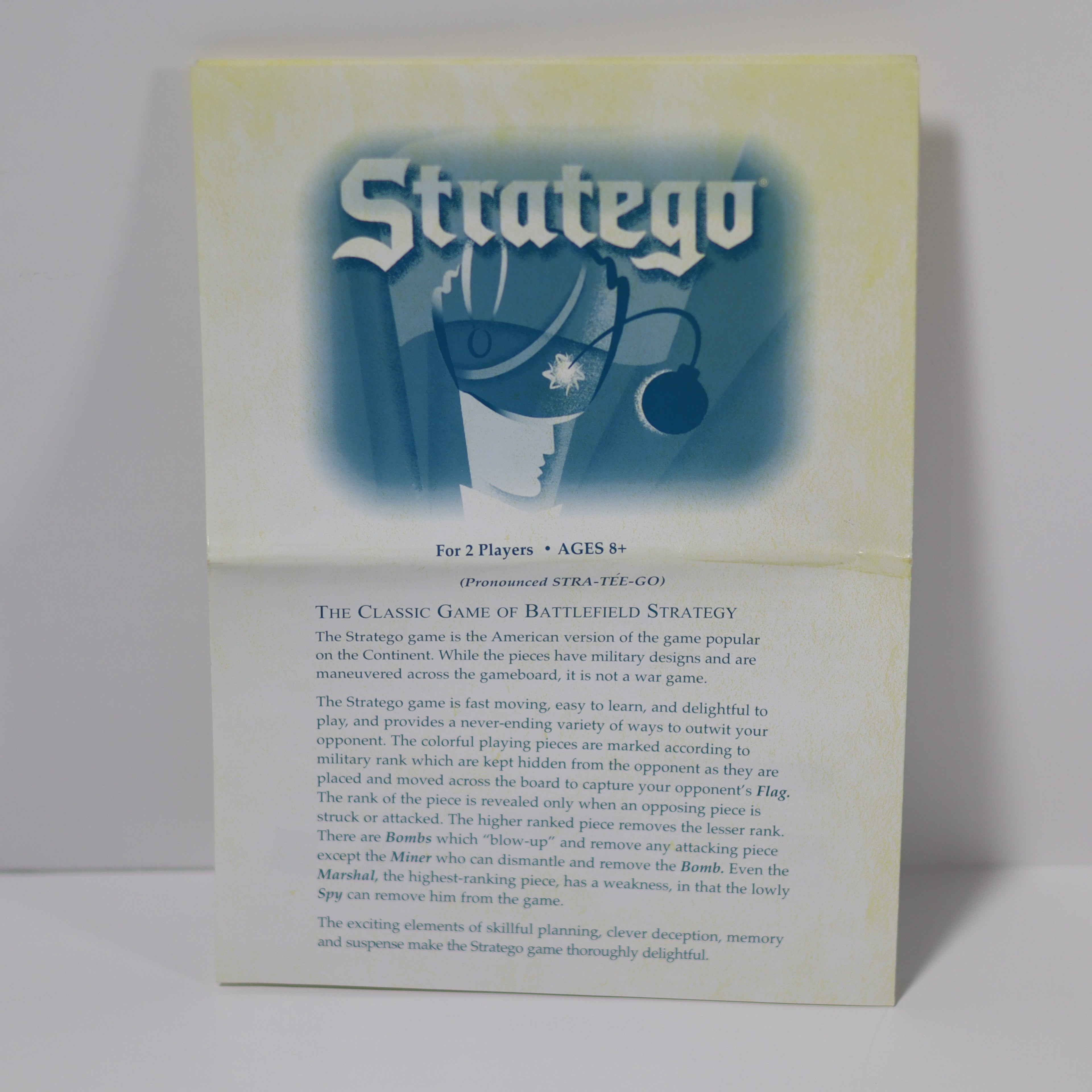 Stratego game box with blue and white design on a light gray background