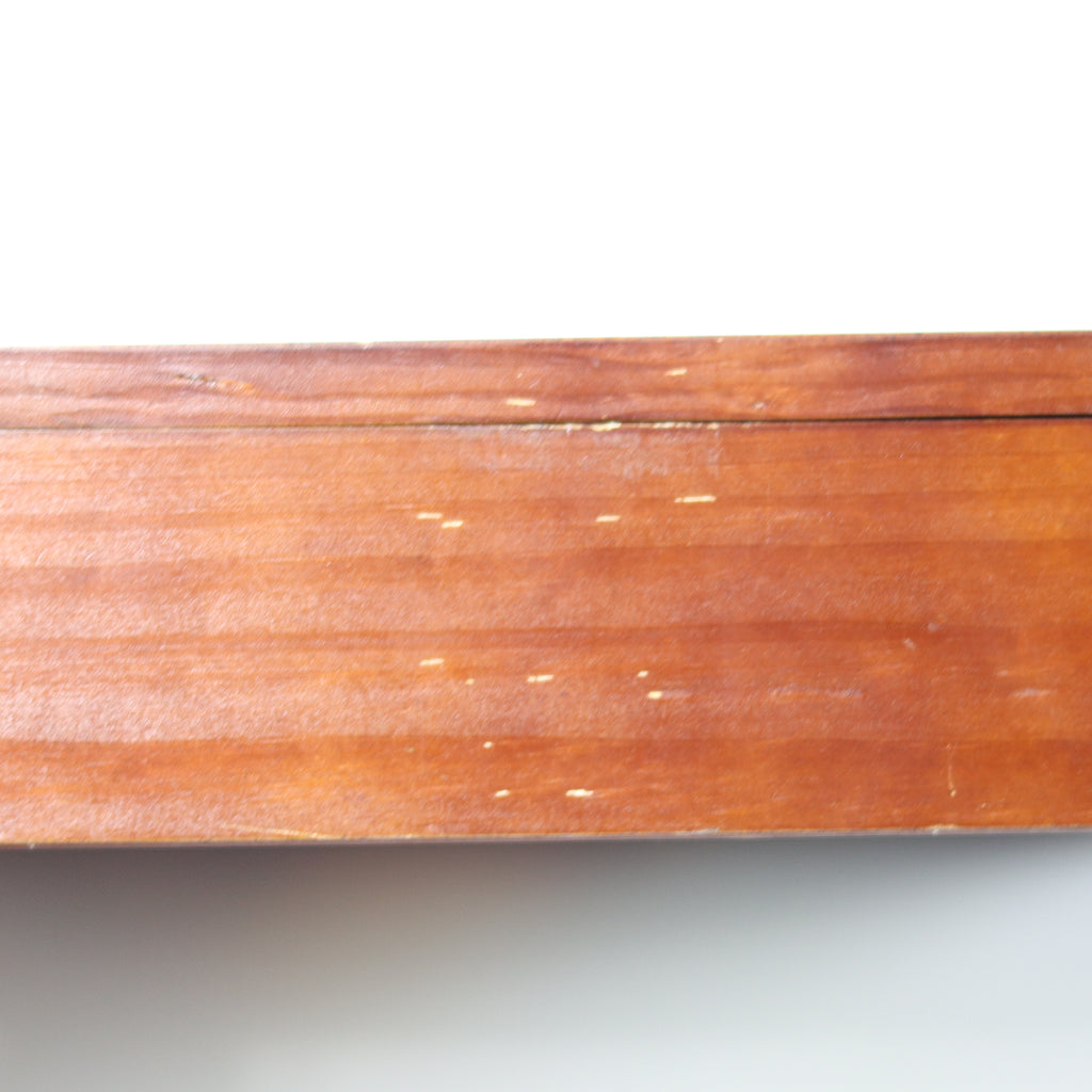Close-up of a wooden surface with visible grain and texture on a white background
