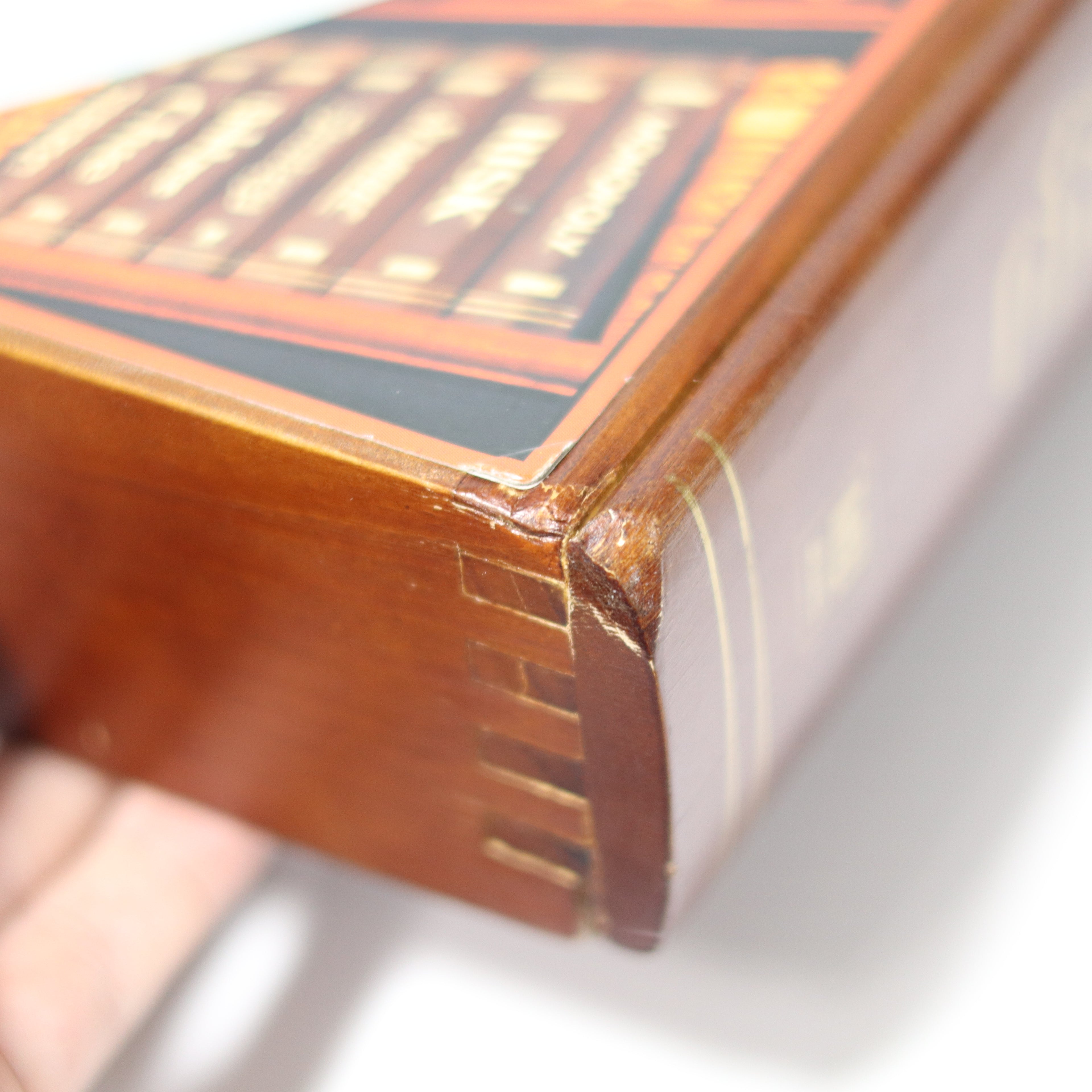 Close-up of a wooden box with a decorative lid