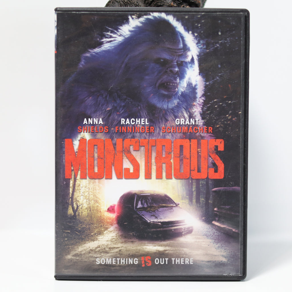 DVD cover of 'Monstrous' with a gorilla and car scene on a white background