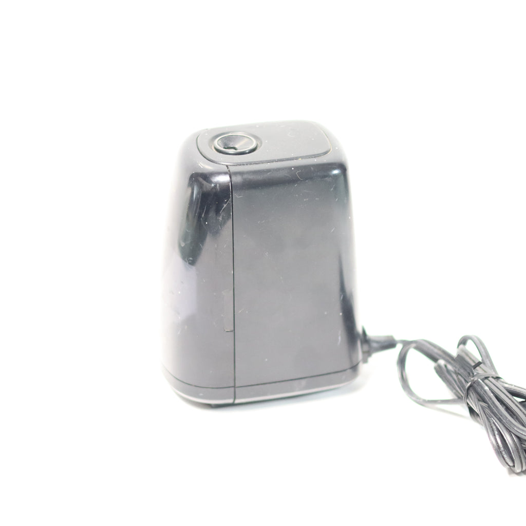 Metallic device with a cord on a white background