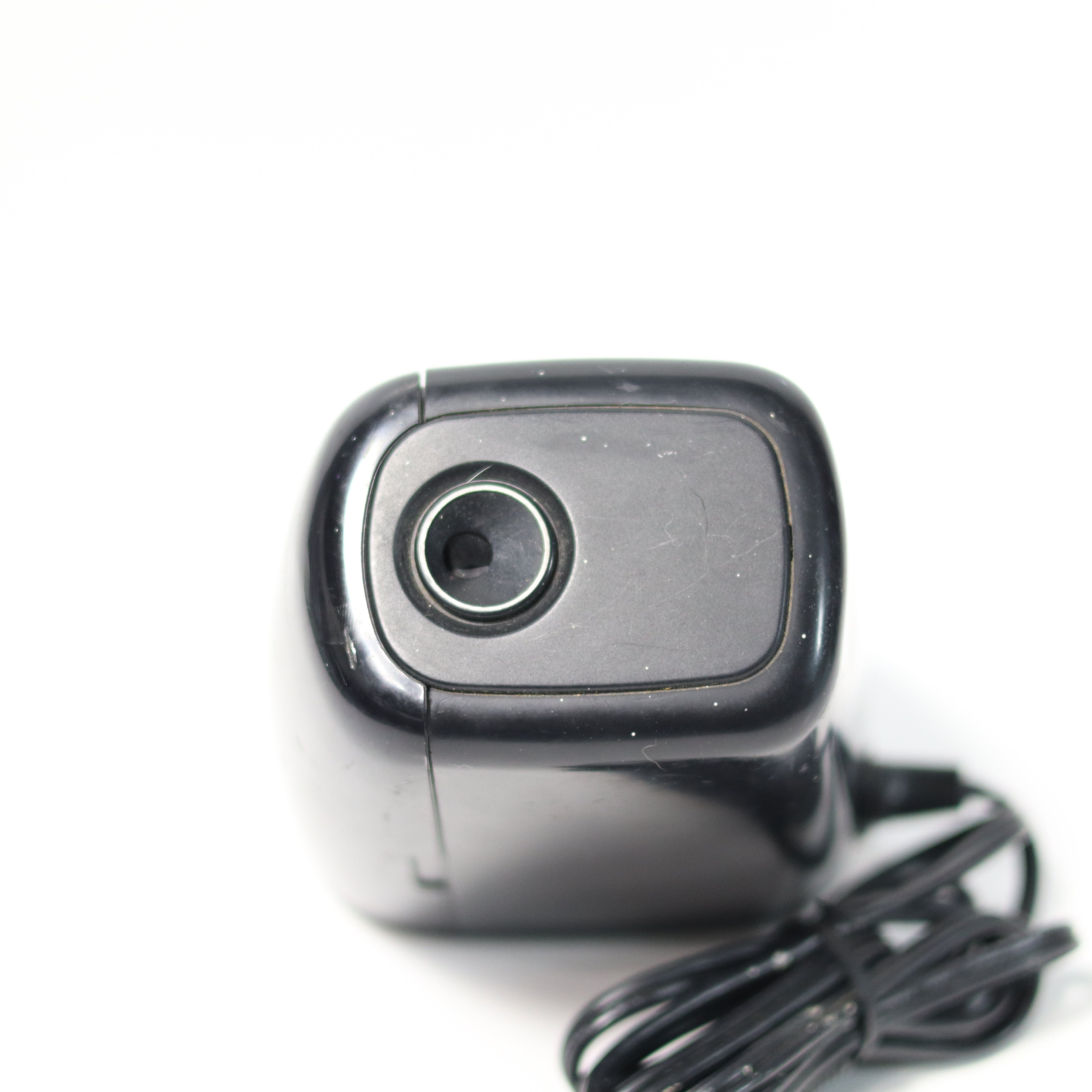 Webcam with a black cord on a white background