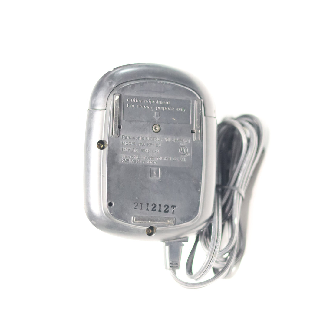 Silver electronic device with a cable on a white background