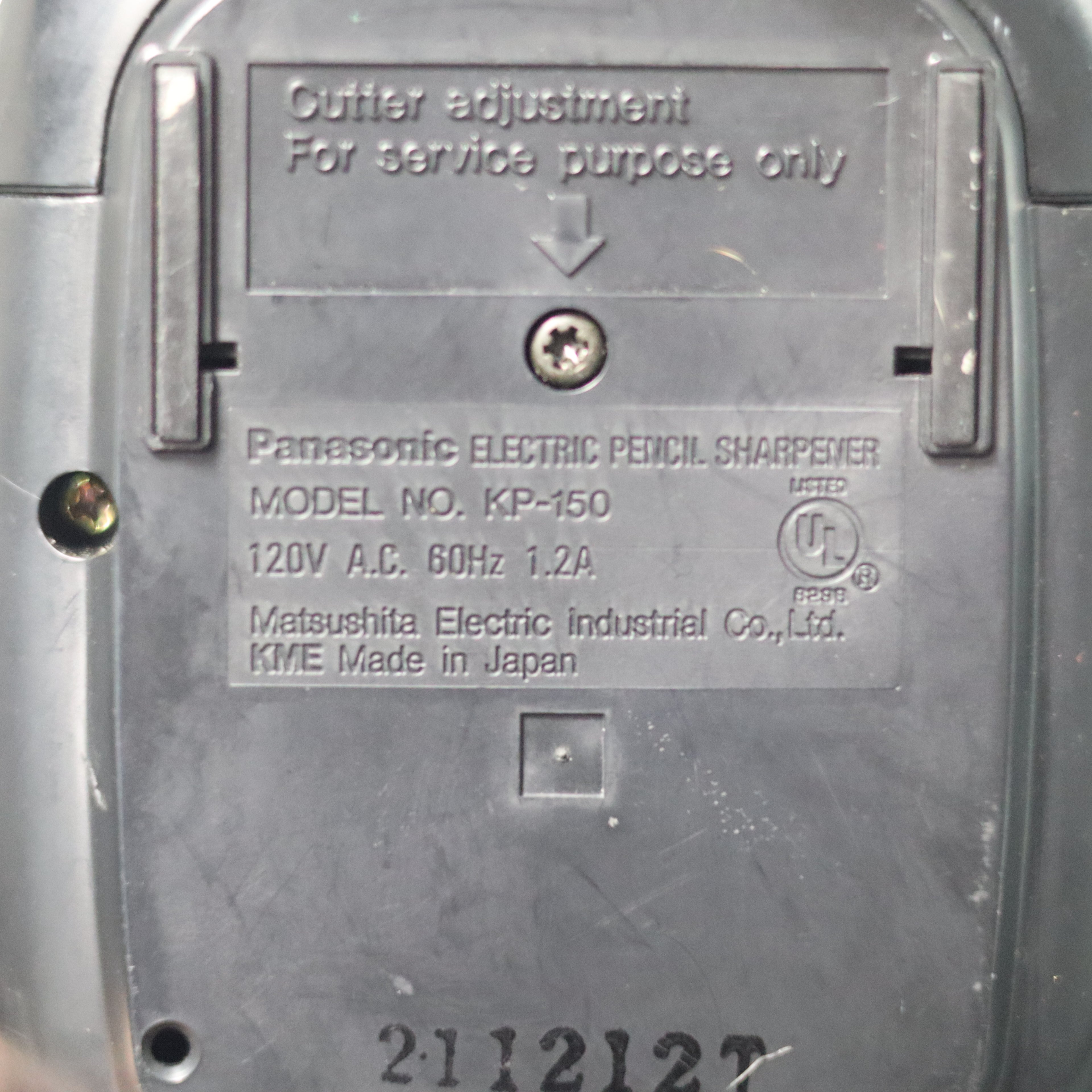 Back of a Panasonic electric pencil sharpener with model details.