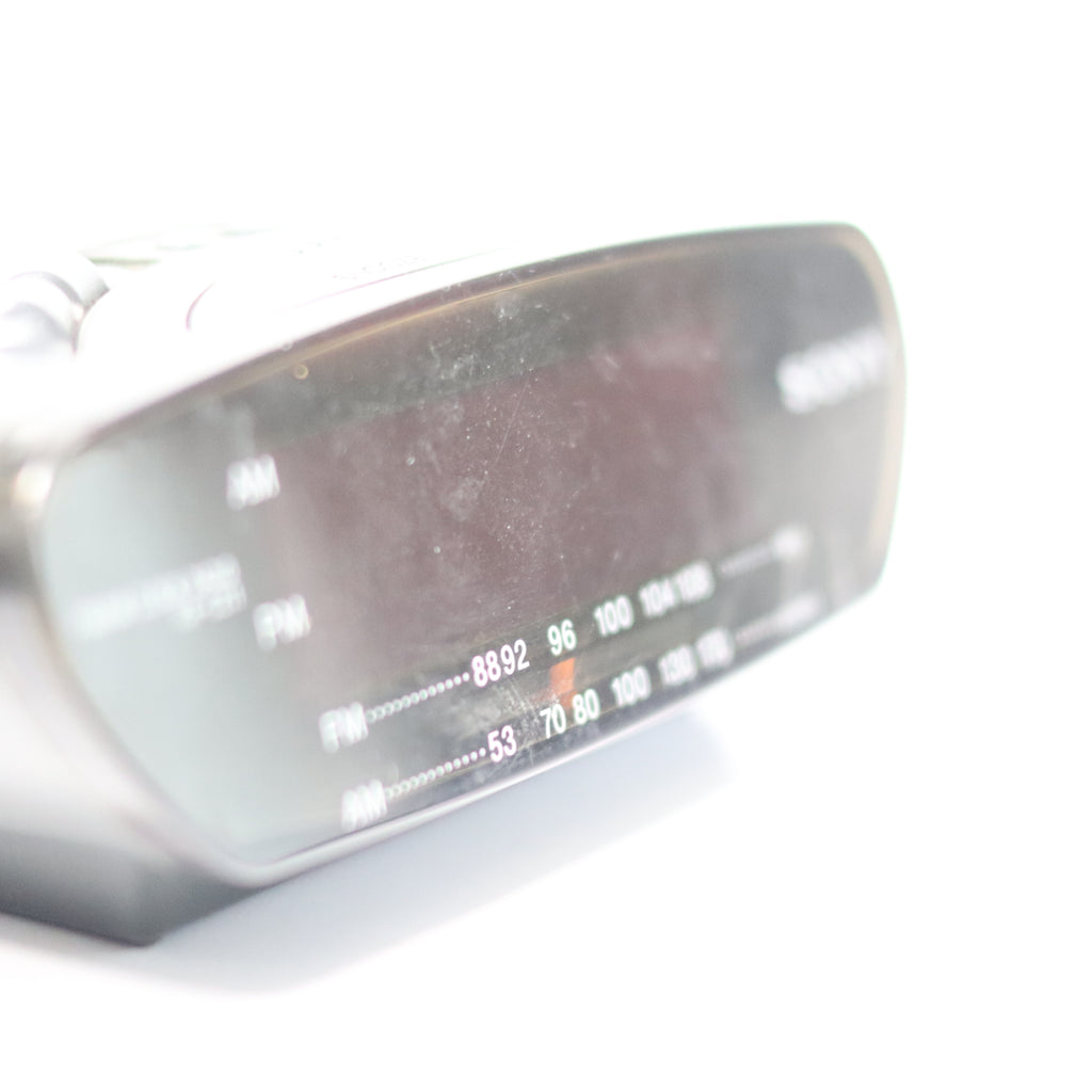 Close-up of a golf club head with a brand logo on a white background