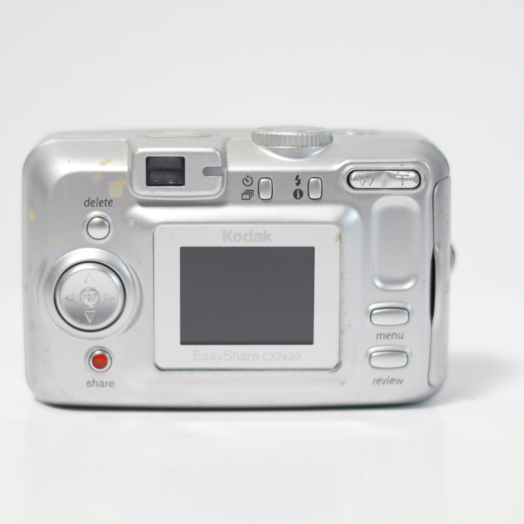Silver Kodak digital camera on a white background