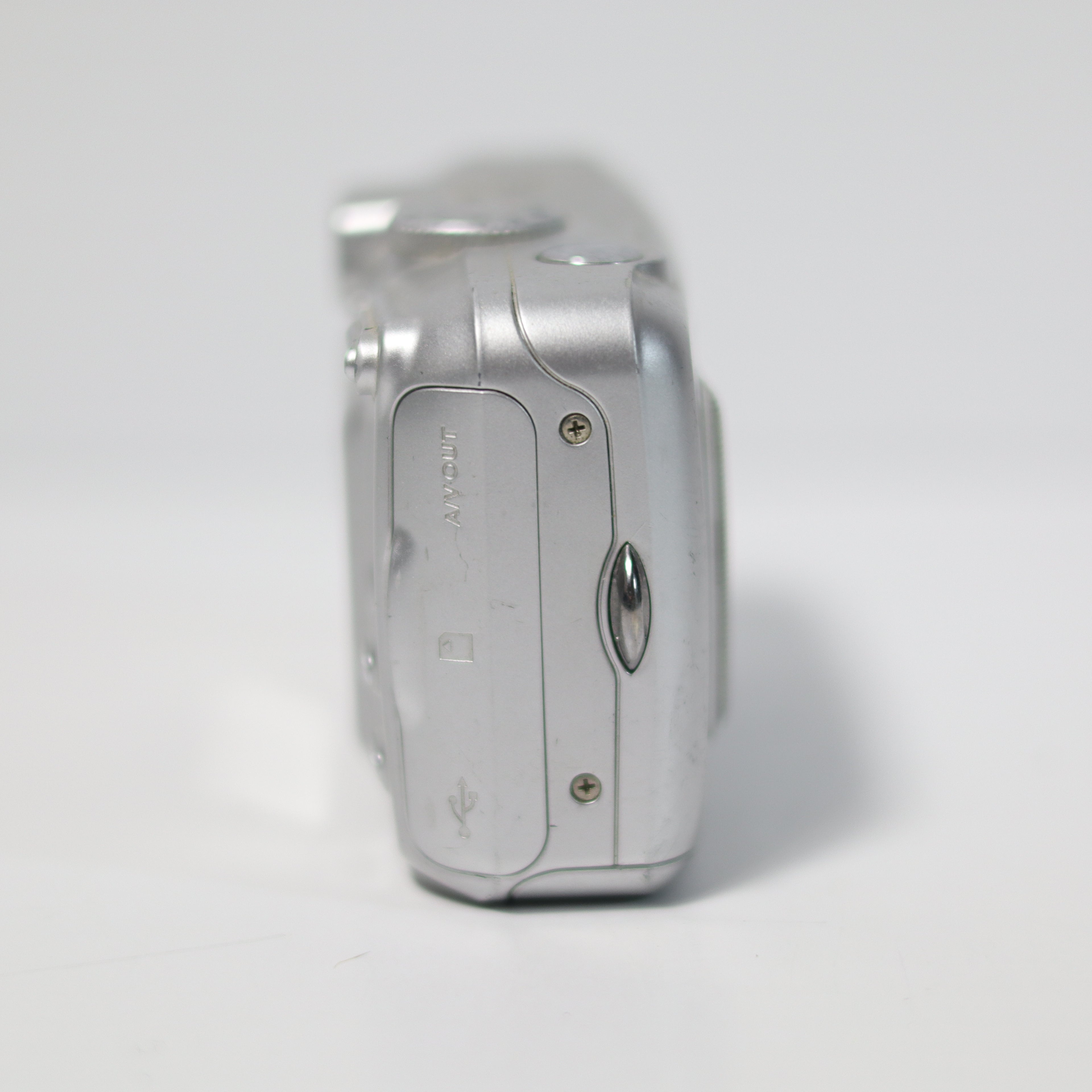 Silver camera on a white background