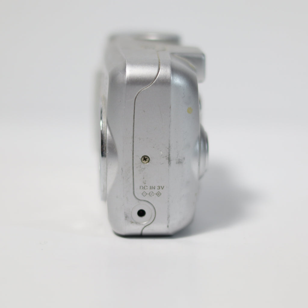 Close-up of a metallic object with text on a white background